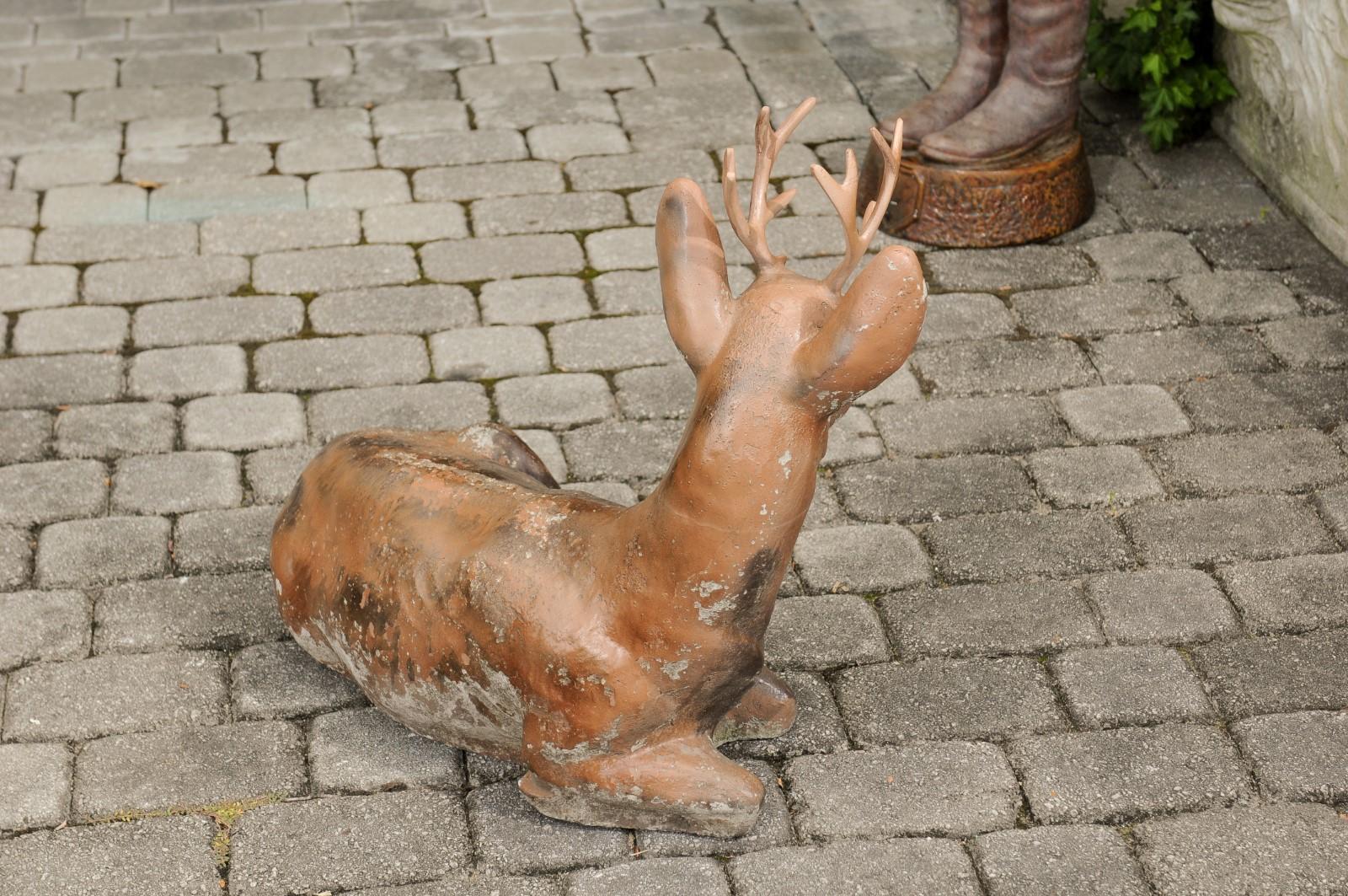 Vintage American Concrete Reclining Deer Sculpture with Iron Antlers and Patina In Good Condition For Sale In Atlanta, GA