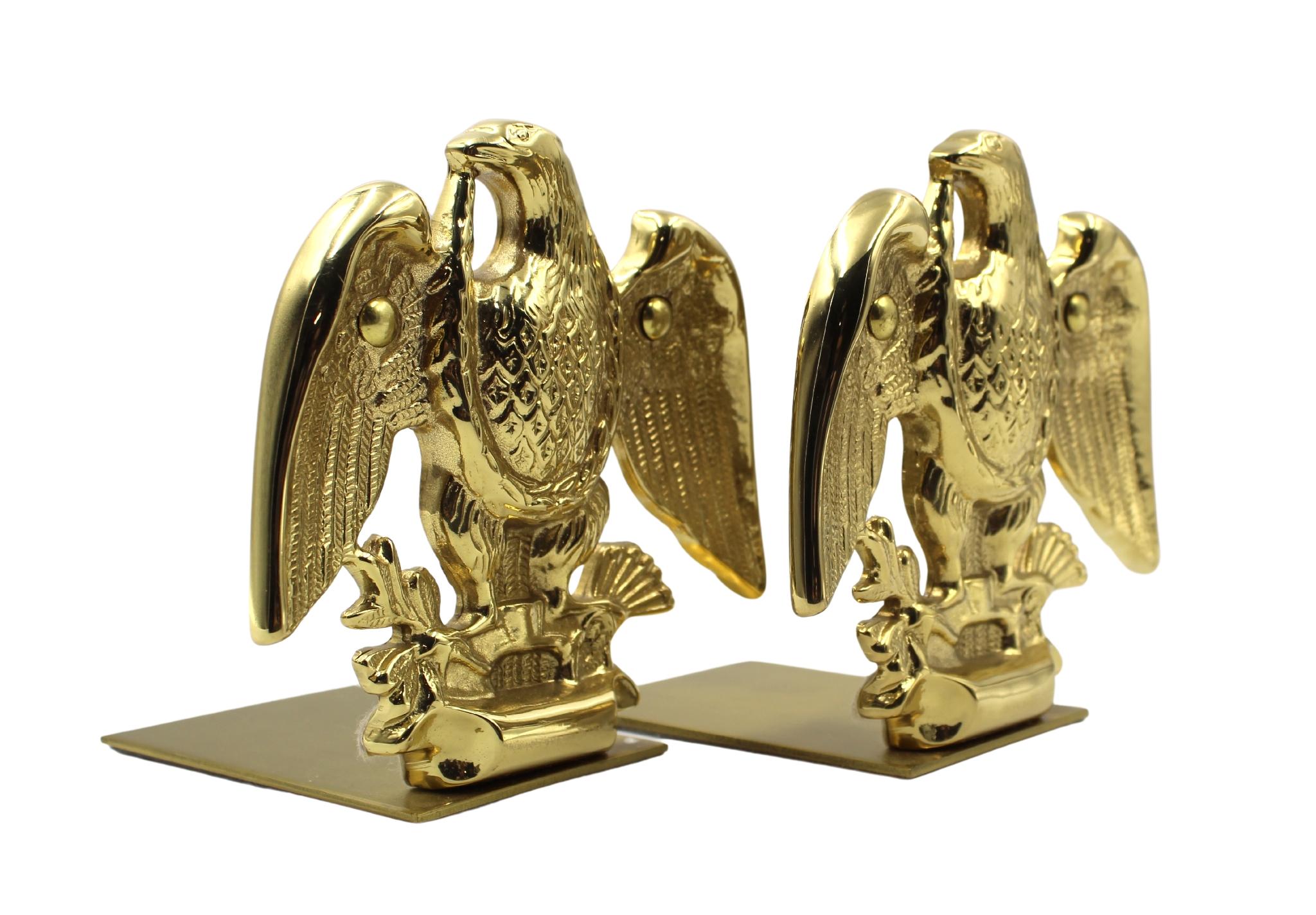 Offered is a set of vintage brass eagle bookends. Each bookend depicts a wingspread eagle clutching a bundle of arrows in its left talon and an olive branch in the right talon. When set against books, the base of the bookends slips underneath and