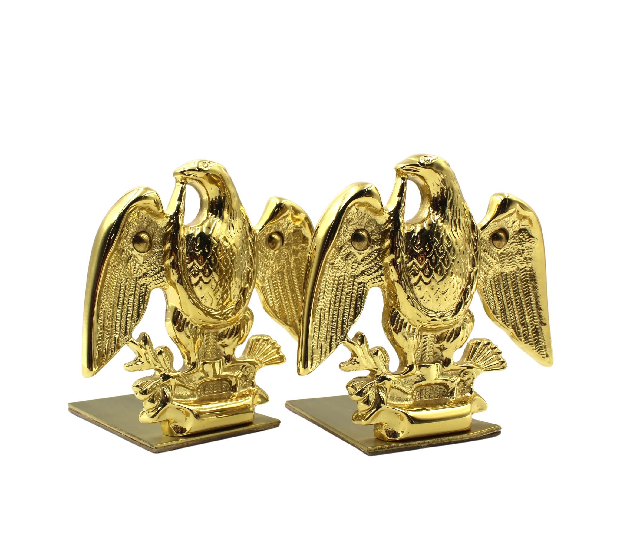 Offered is a set of vintage brass eagle bookends. Each bookend depicts a wingspread eagle clutching a bundle of arrows in its left talon and an olive branch in the right talon. When set against books, the base of the bookends slips underneath and
