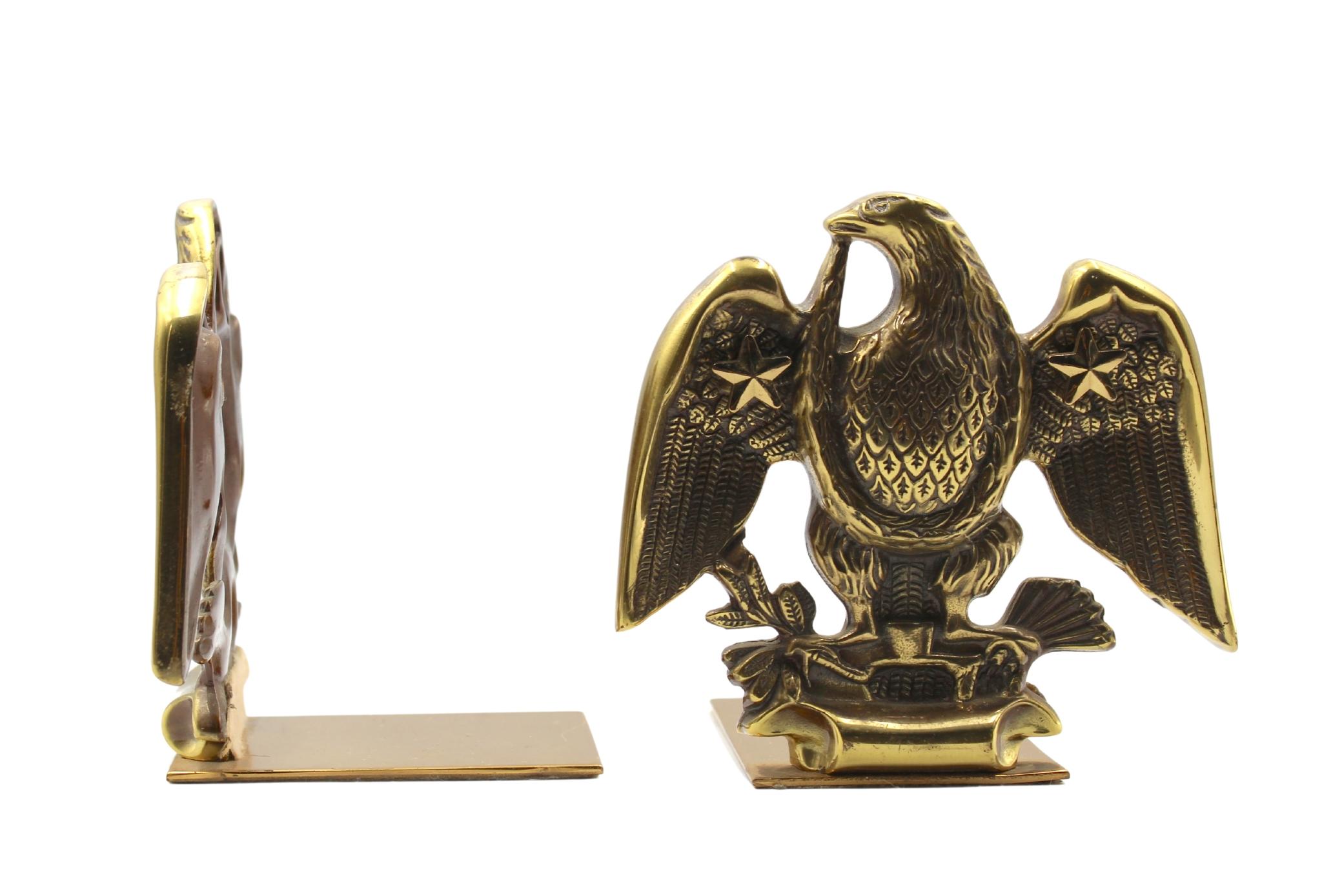 Offered is a set of vintage brass eagle bookends. Each bookend depicts a wingspread eagle clutching a bundle of arrows in its left talon and an olive branch in the right talon. When set against books, the base of the bookends slips underneath and