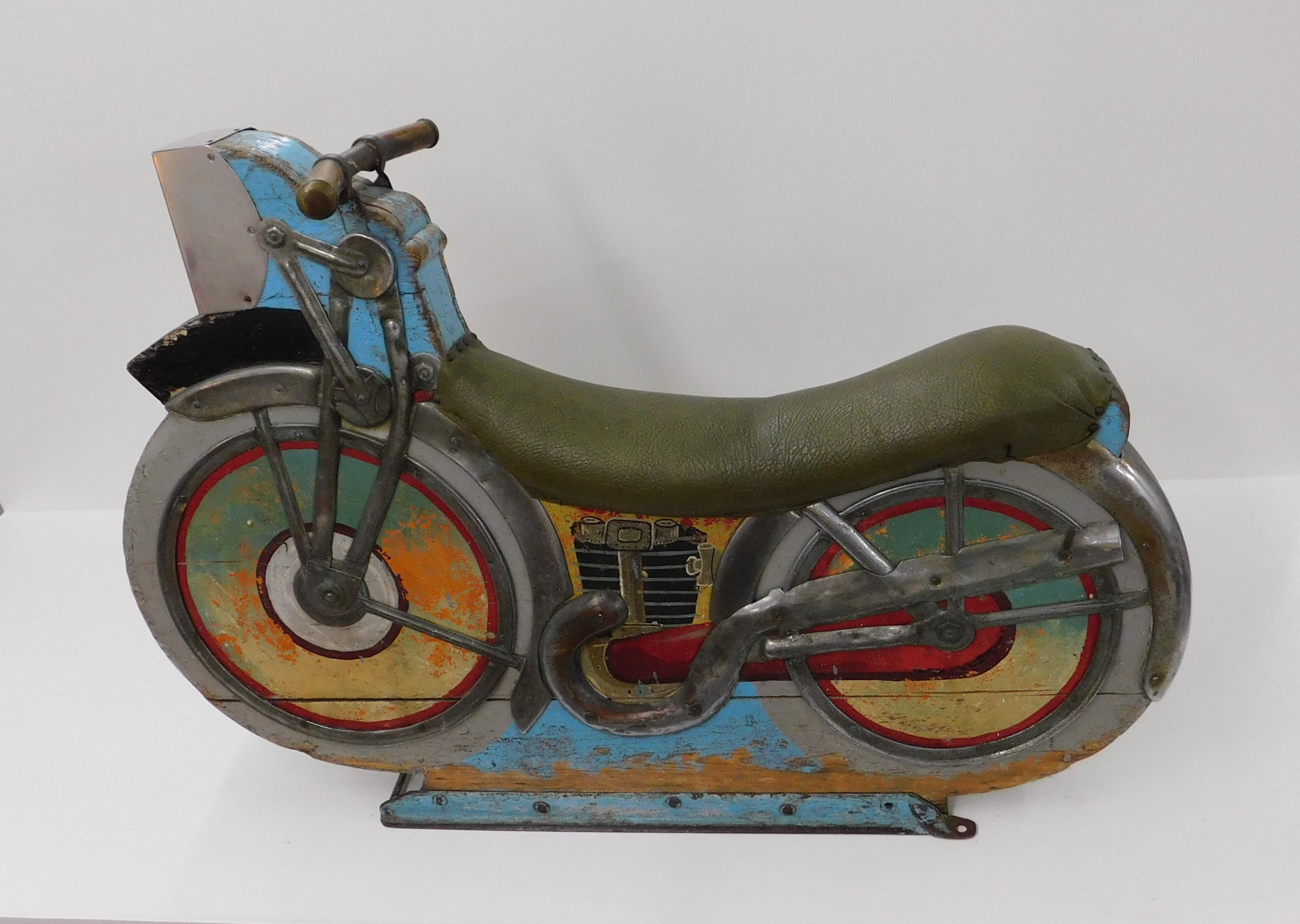 This 1930s-1940s antique midway amusement park wooden motorcycle ride is one of the earliest produced for carousels and merry-go-rounds and has a wonderfully aged patina. Two-sided, original paint, padded seat, steel/chrome exhaust pipes and