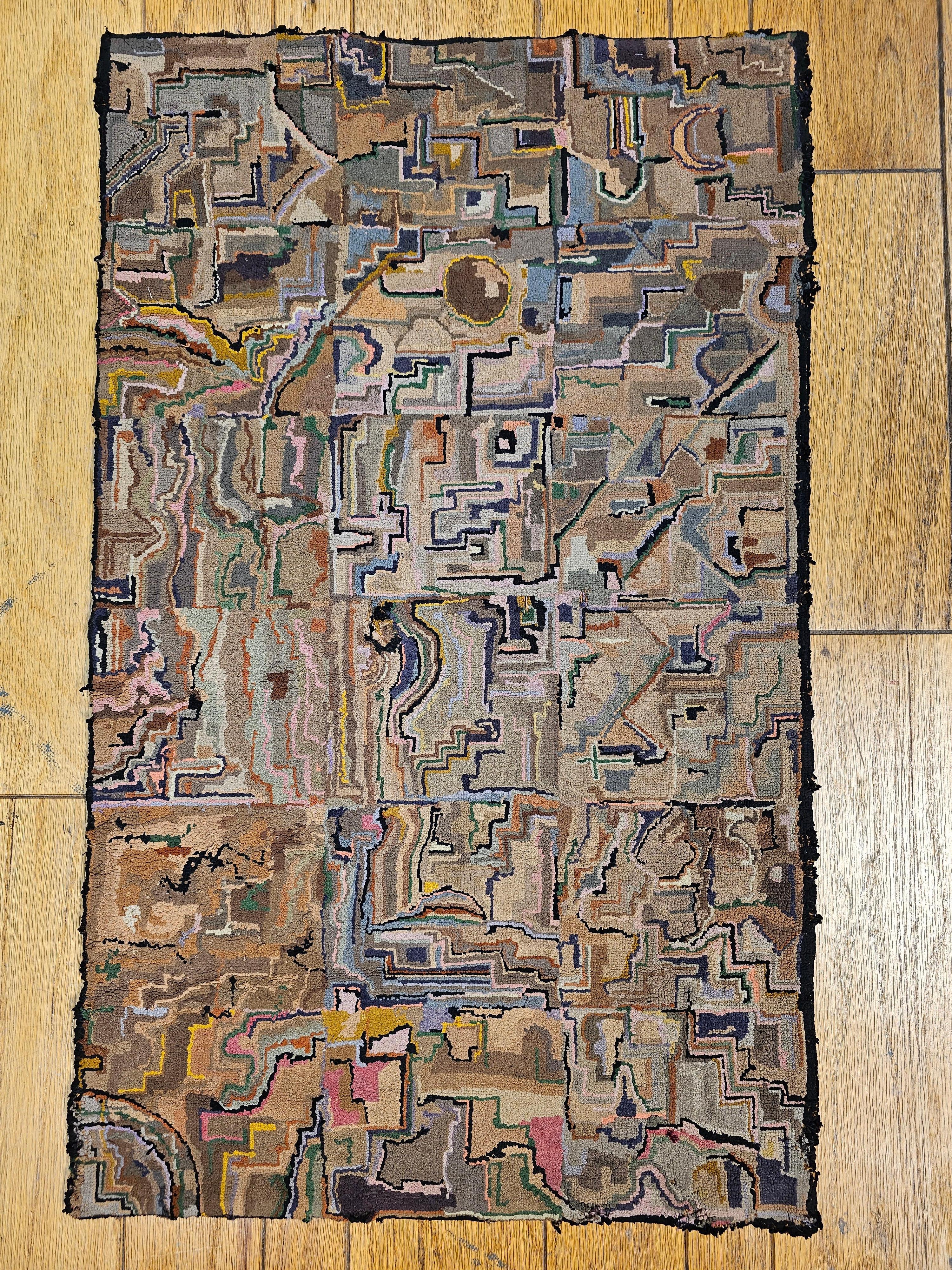 19th Century hand hooked rug in a free form design,  We are intrigued with the novelty and the imagination of the maker in creating such a wonderful and rare design in earth tone colors.  The  hooked rugs from the late 19th and early 20th centuries