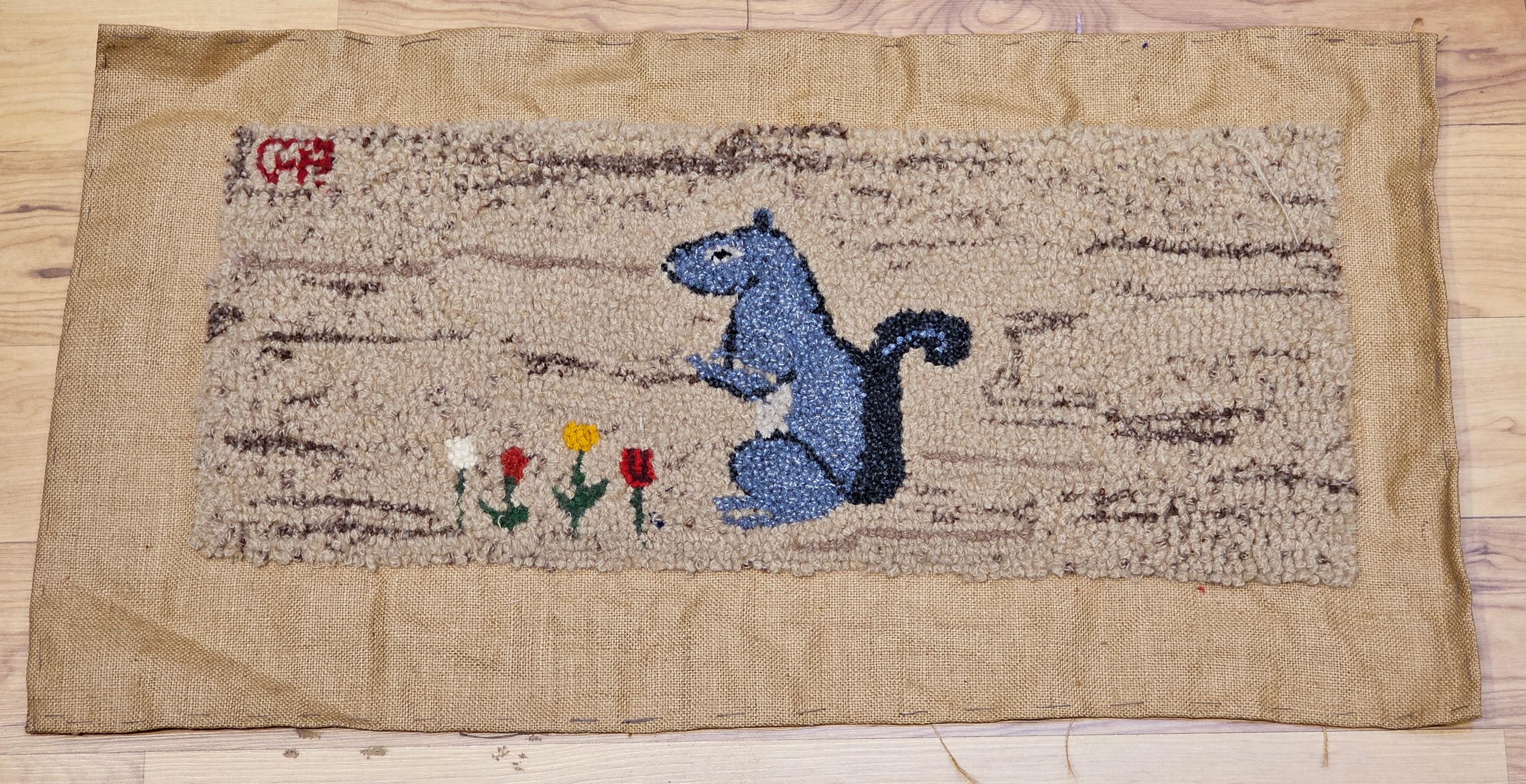 Vintage American  hand hooked rug in a wonderful depiction of a standing squirrel and looking out design.  The rug has a delightful design and colors including Khaki background and design colors of  lavender red, green, yellow and white.    We are