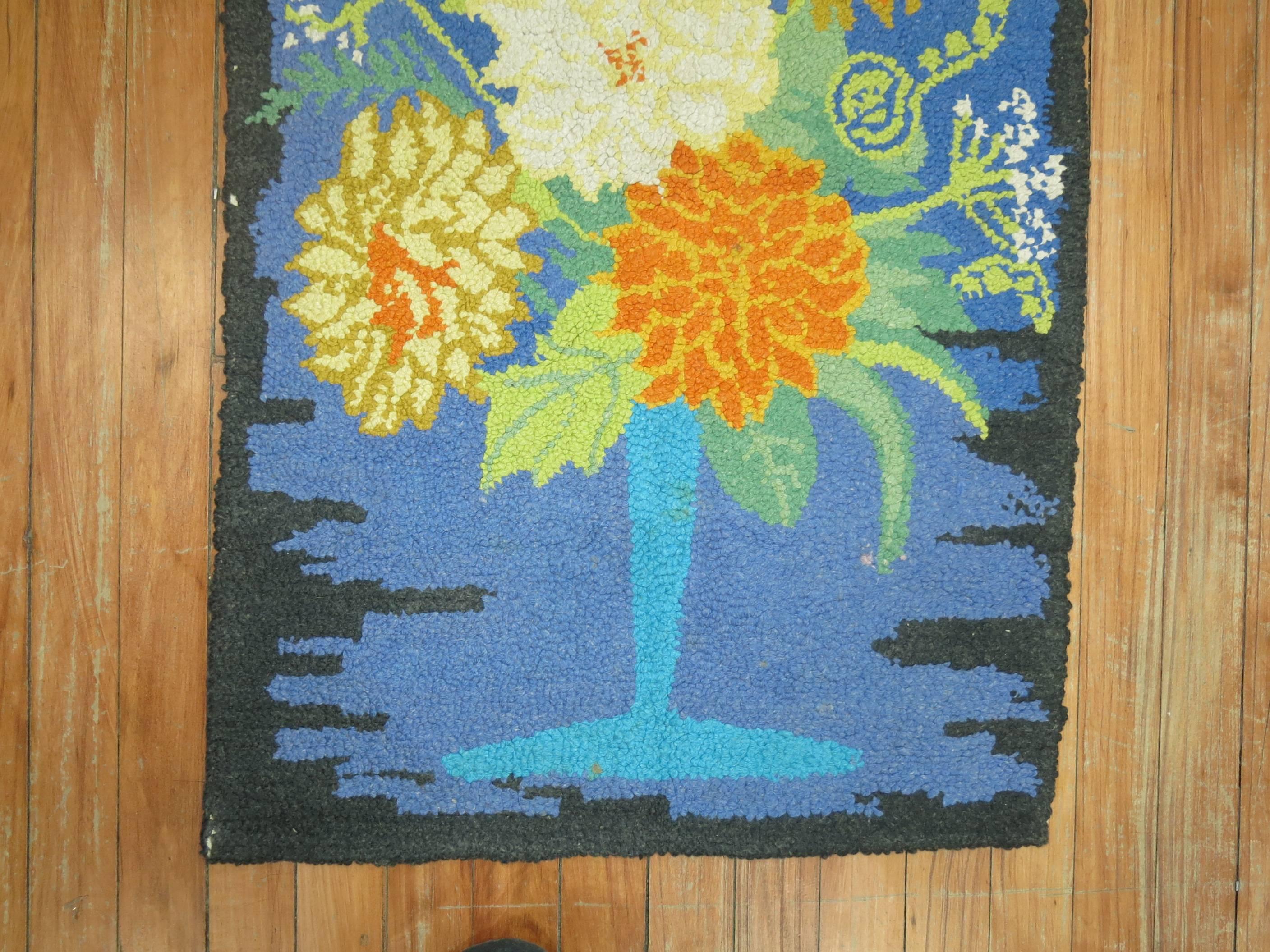 An American Hooked rug from the middle of the 20th century with a flower vase design.