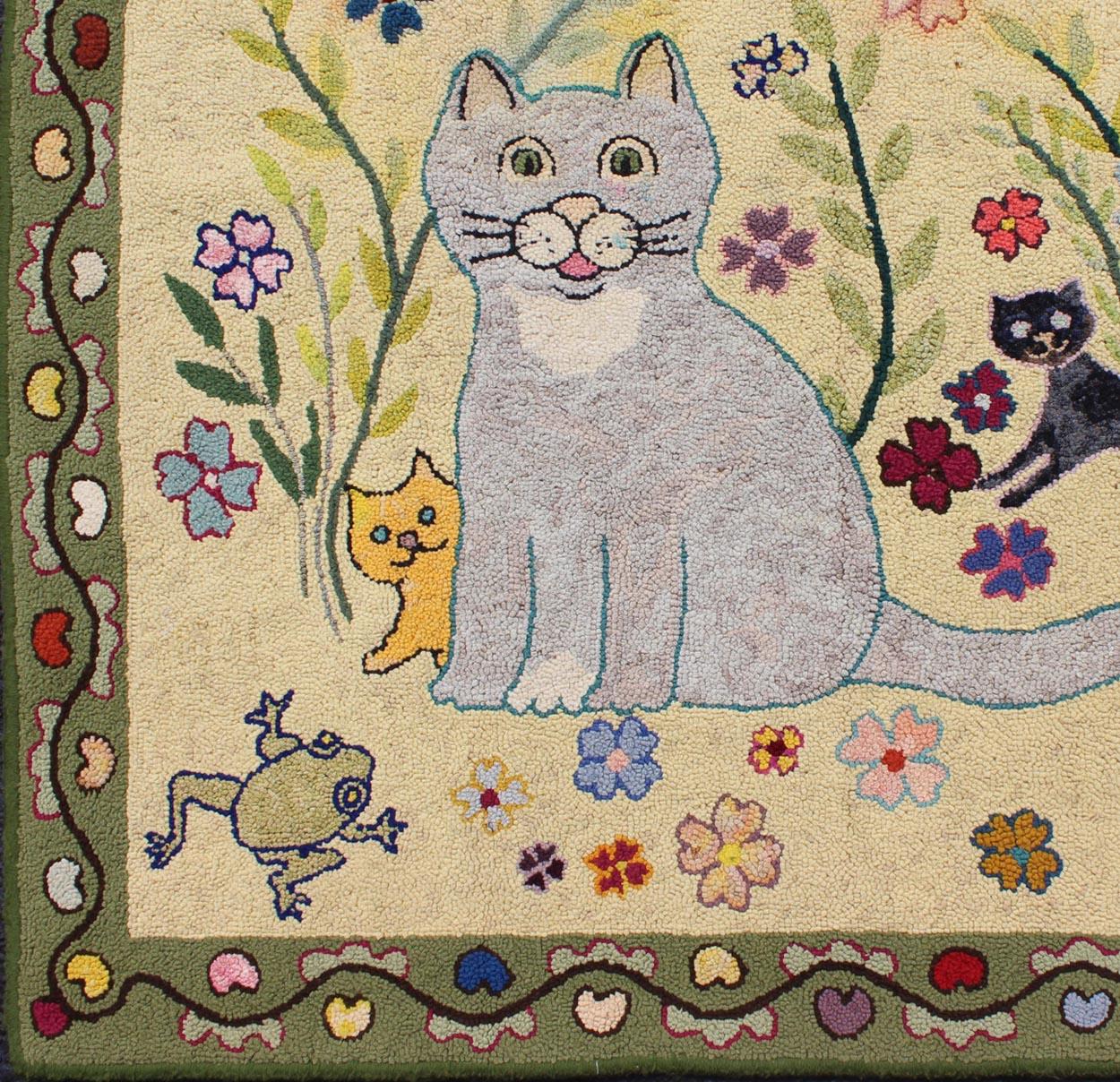 Vintage American hooked rug with cats, butterfly, frog, turtle, and flowers, rug s12-0411, country of origin / type: United States / Hooked, circa mid-20th century

This vintage American Hooked rug depicts a lively cat sitting among an array of