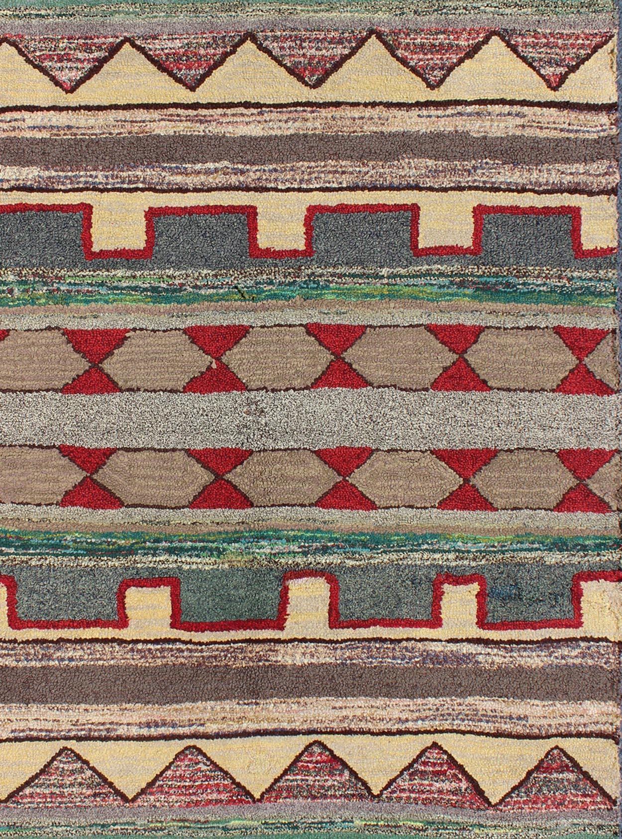 Vintage American hooked rug with geometric tribal designs, Keivan Woven Arts / rug J10-1014, country of origin / type: United States / Hooked, circa 1950

Ingenious in style, color and composition, the features in this spectacular, vintage