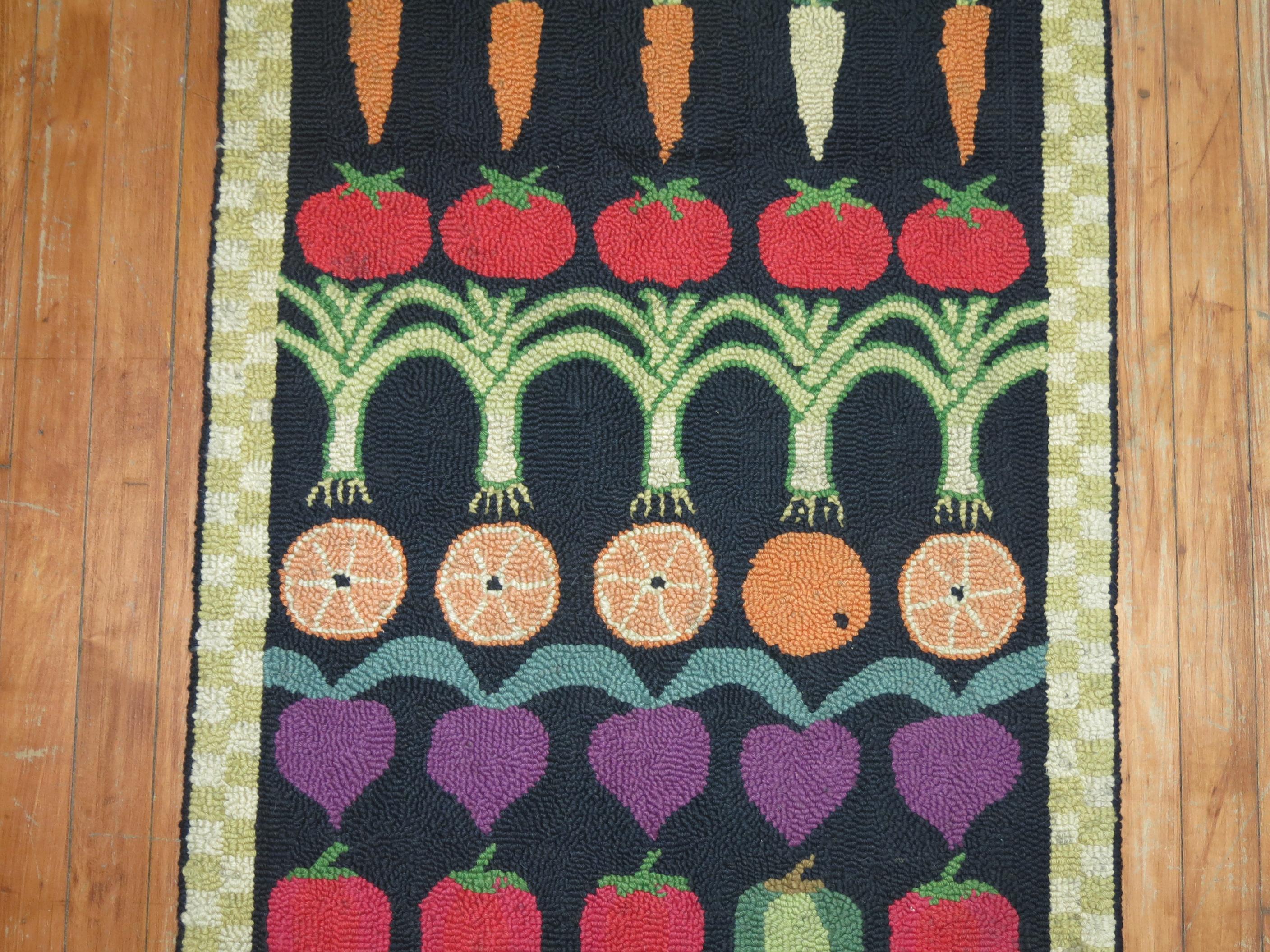 A handmade American Hooked rug from the early part of the 20th century showing rows of different fruits and vegetables. Condition is really nice no stains, no tears, has been professionally cleaned. Backed with blue fabric.