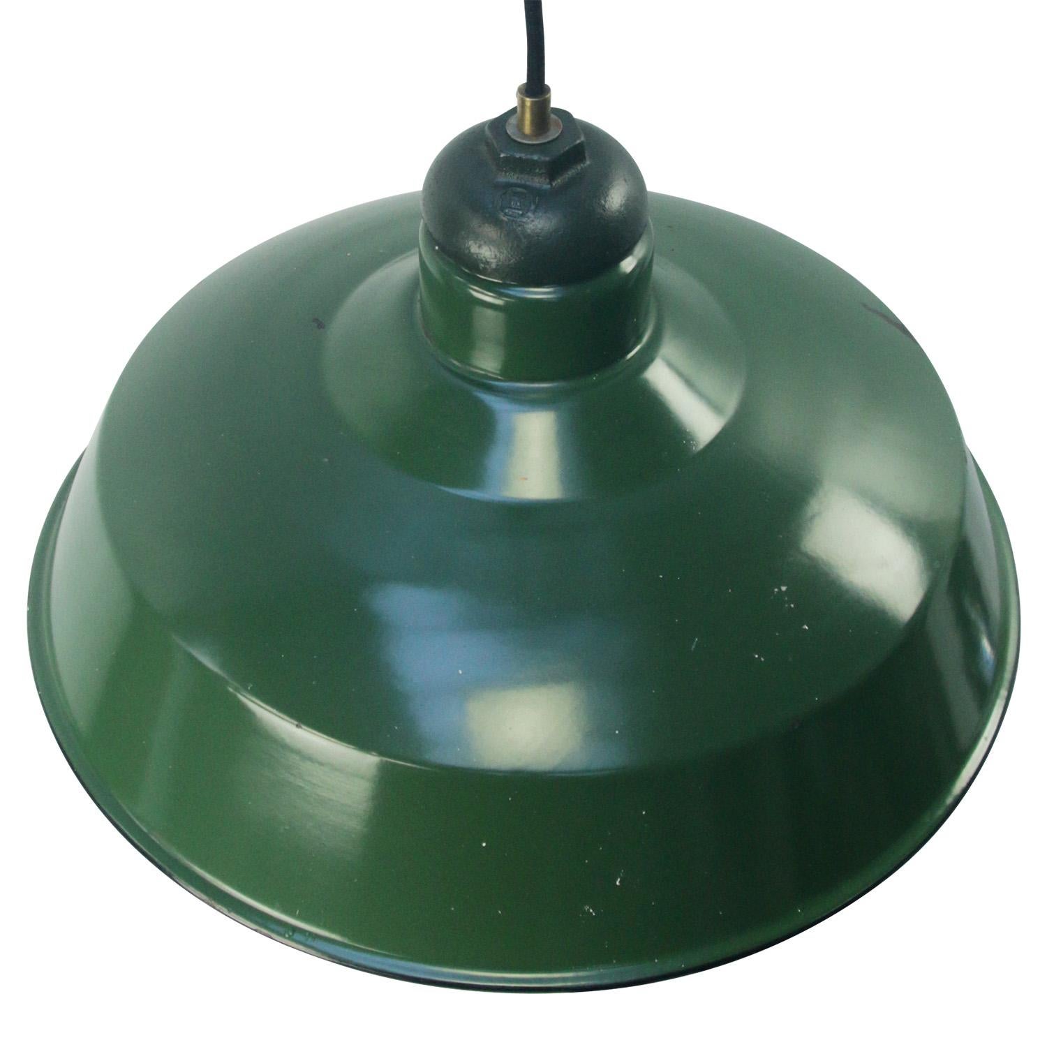 Vintage American green enamel industrial pendant lamp
Cast iron top
White interior

Weight: 2.40 kg / 5.3 lb

Priced per individual item. All lamps have been made suitable by international standards for incandescent light bulbs,