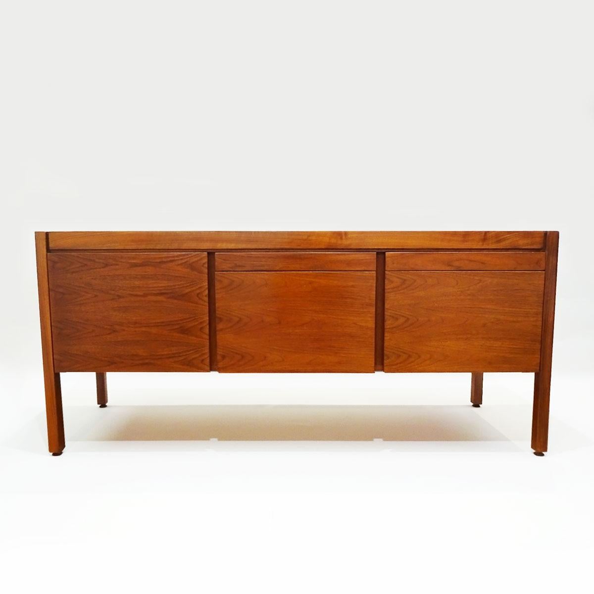 A very solid and well-built vintage walnut office Bureau by Danish American designer Jens Risom for JRD that could also be used as a sideboard or credenza.

Born in Copenhagen in 1916 Risom stands out as an exemplar of the Mid-Century Modern design
