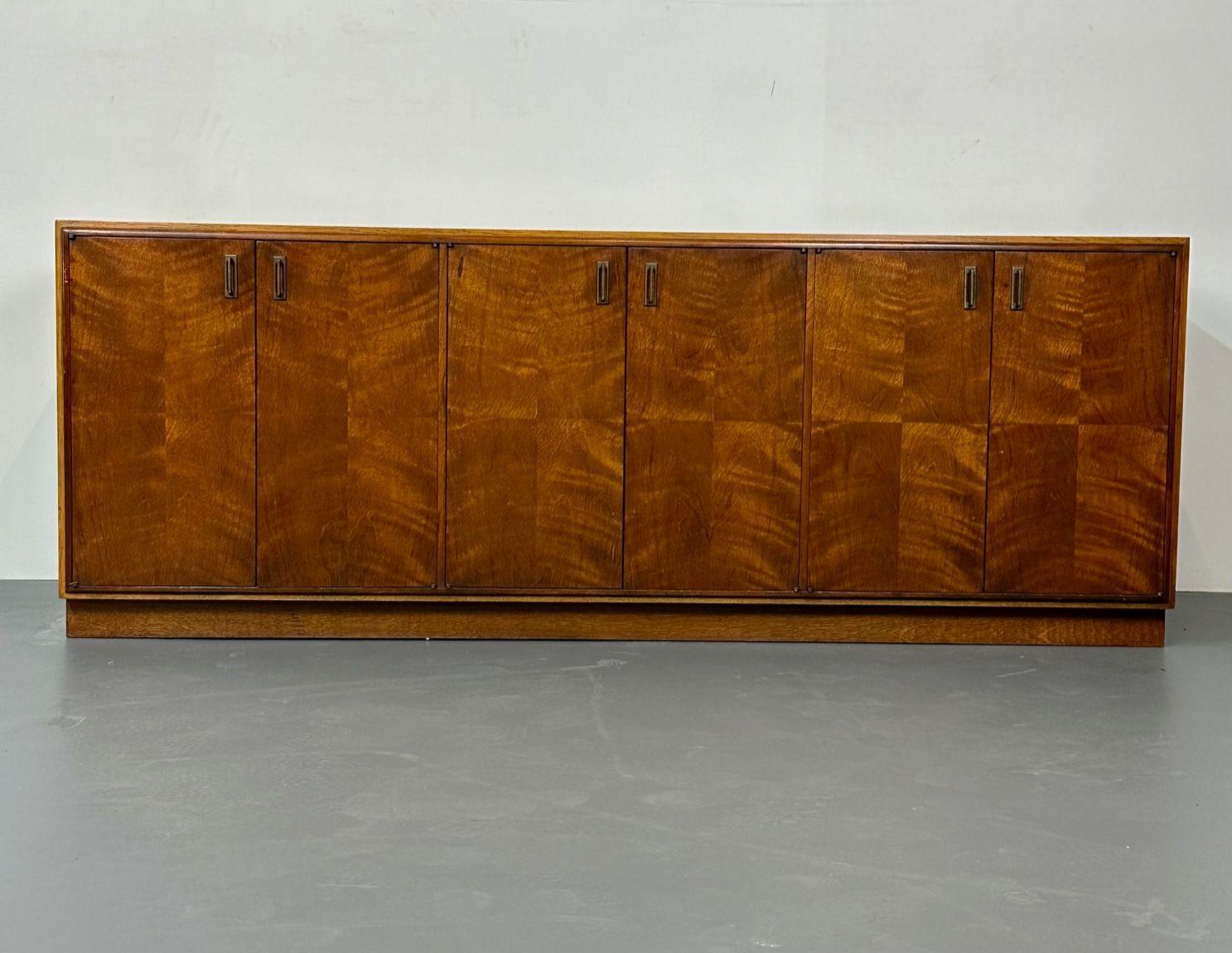 Vintage American Mid-Century Modern, dresser, sideboard or buffet, Founders
 
A finely crafted Founders Furniture dresser with three double door divisions. The center double door section opens to four fitted interior drawers while the left and