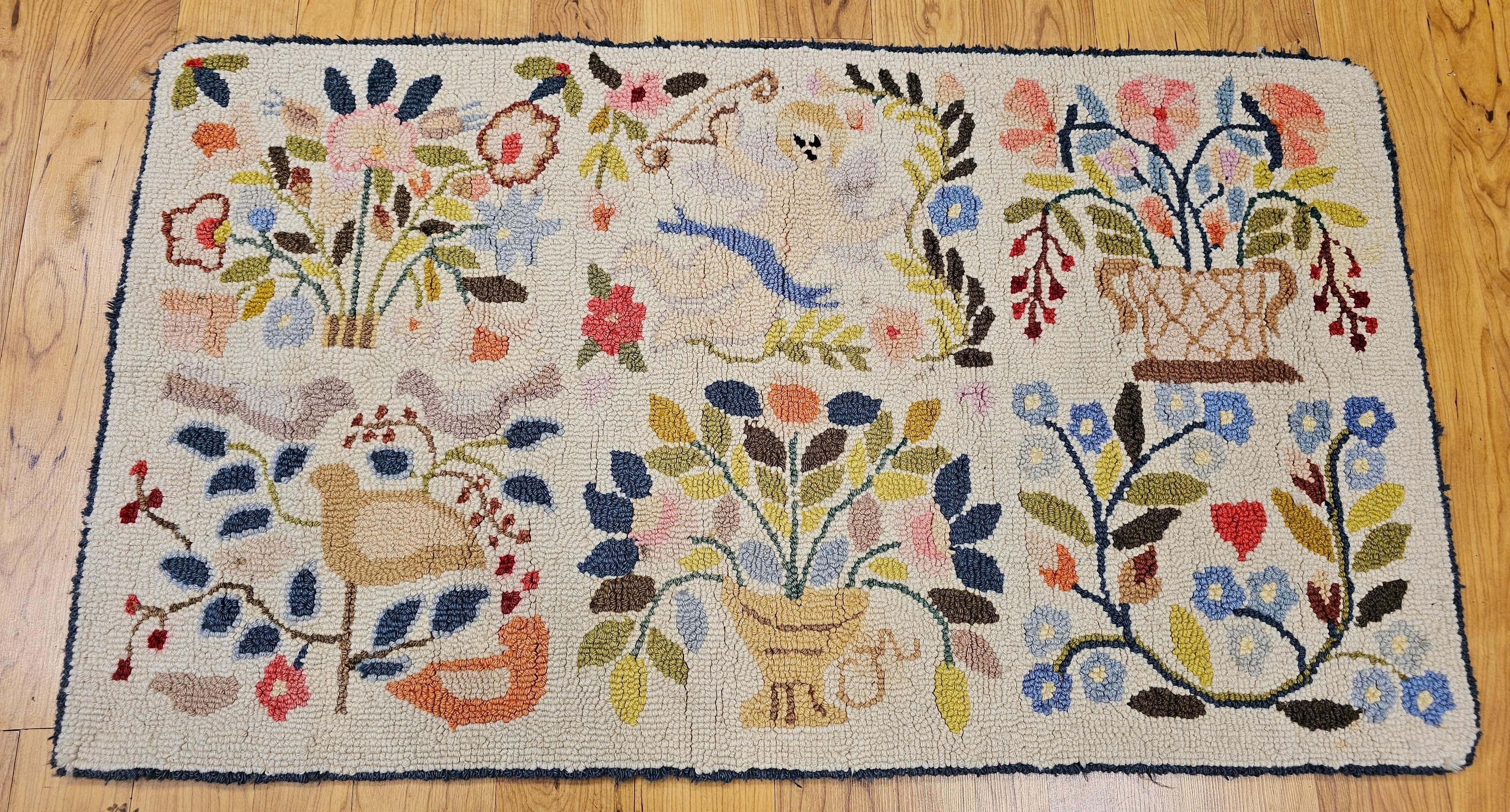 Vintage Claire Murray hand hooked pictorial rug.  The rug has a delightful design and colors.   The rug has an ivory color background with designs in green, red, blue and brown colors.  We are intrigued with the novelty and the imagination of the