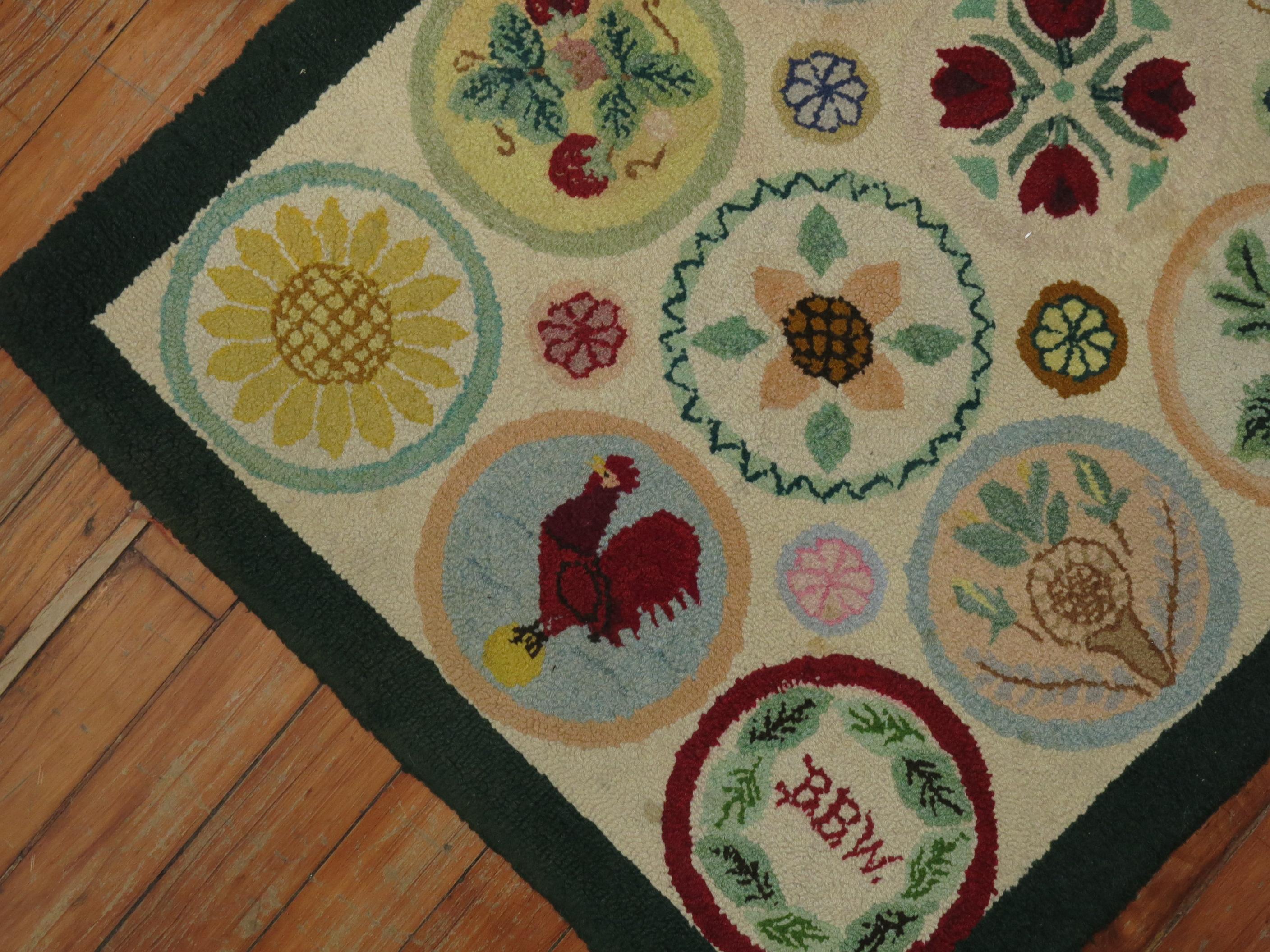 American hooked rug from the late 20th century. An array of fruits and on circular medallions. A rooster spotted on one of the medallions. Initials of weaver found on another medallion.