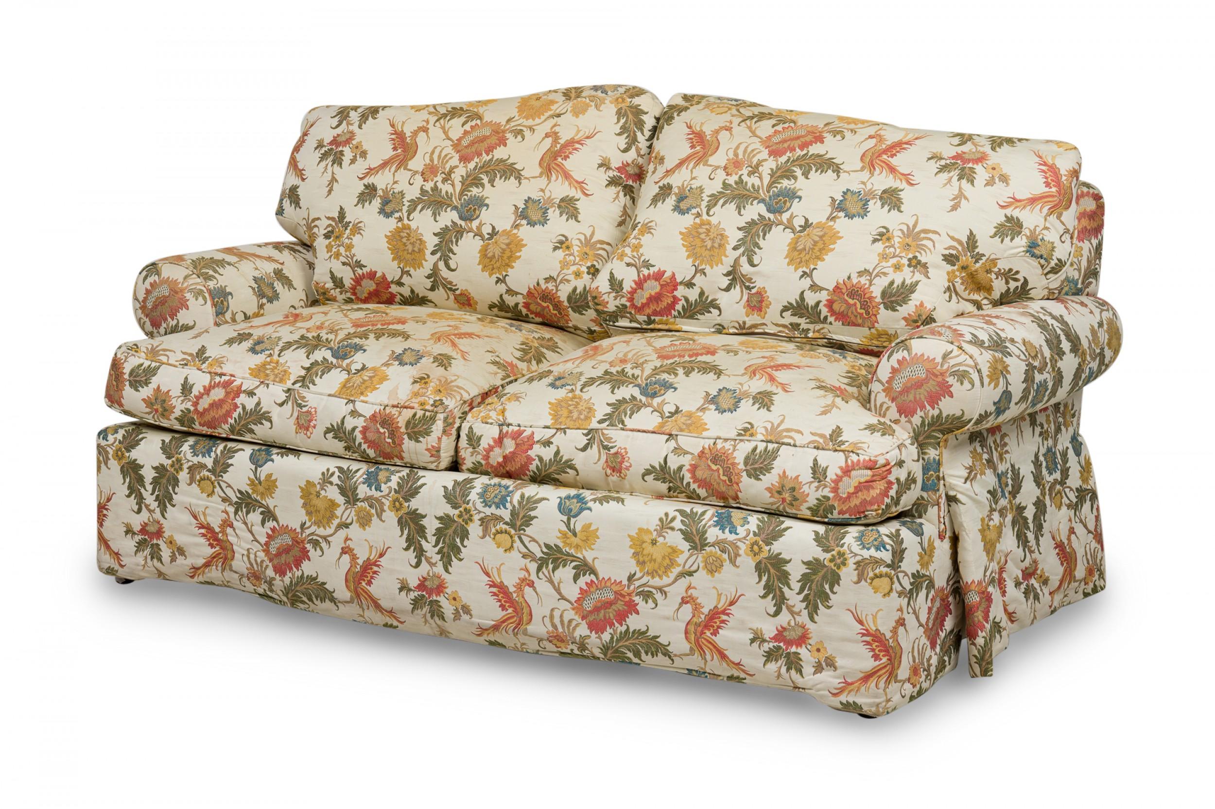 Vintage American plush sofa upholstered in a Clarence House floral patterned fabric with a beige ground.
