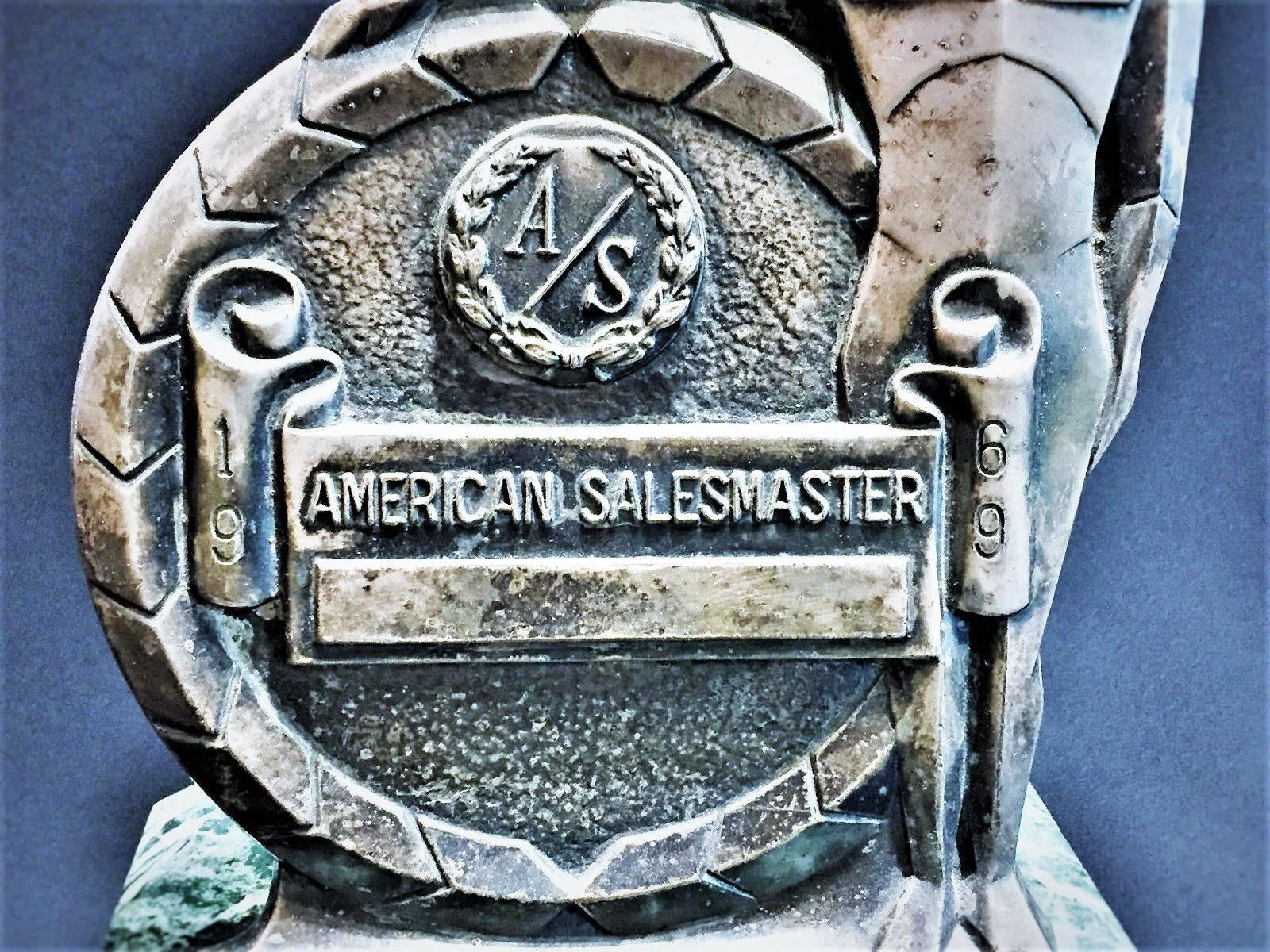 The inscription on the silvered bronze plaque reads: 
A/S 1969 AMERICAN SALESMASTER. 
The place for the awardees name is blank.
Solid marble octagonal base.
No dings, dents, or chips.
The piece has never been cleaned and selling, as obtained.