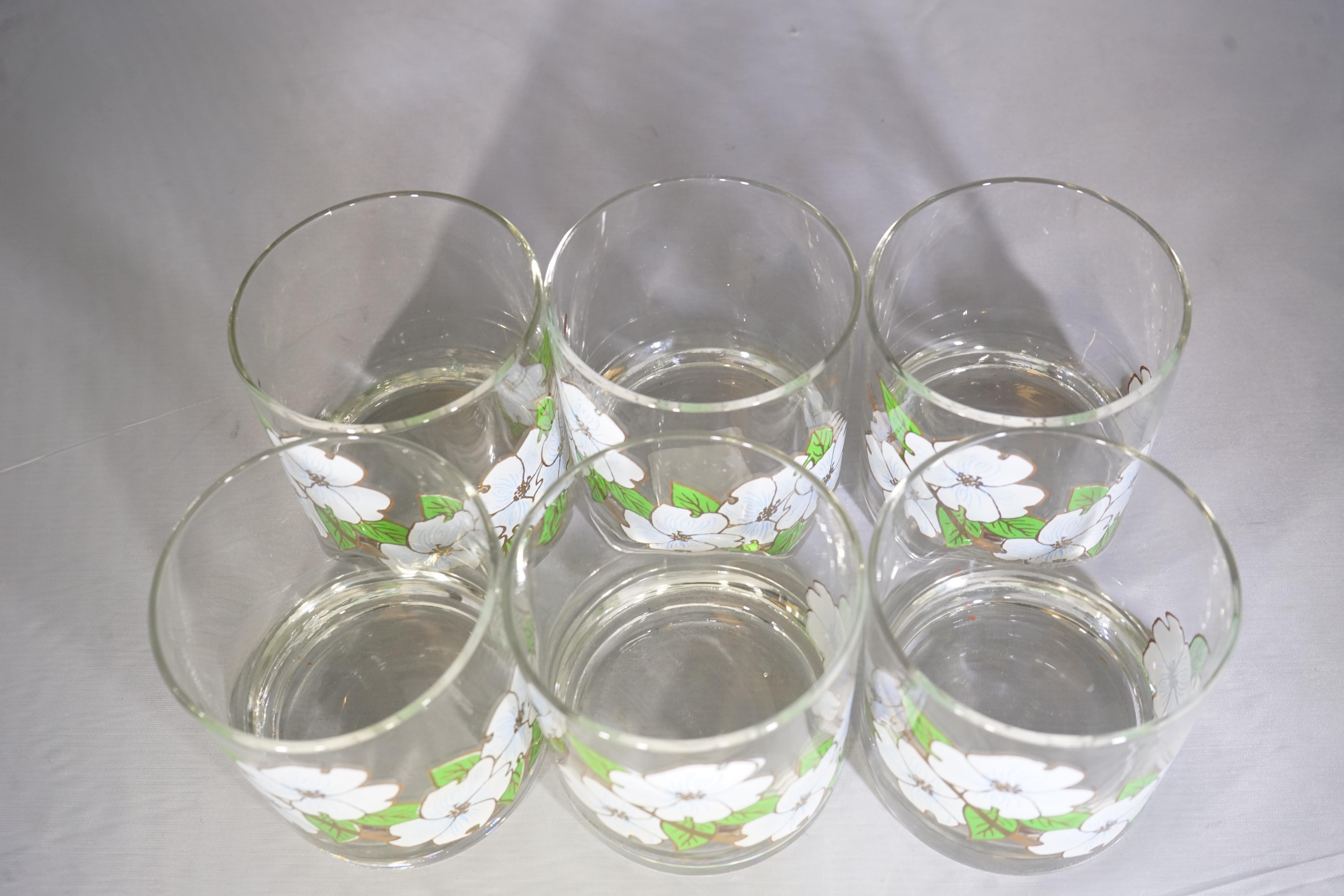 Set of six vintage Couroc unique rock glasses featuring painted dogwood blossoms design with white flowers and green leaves.