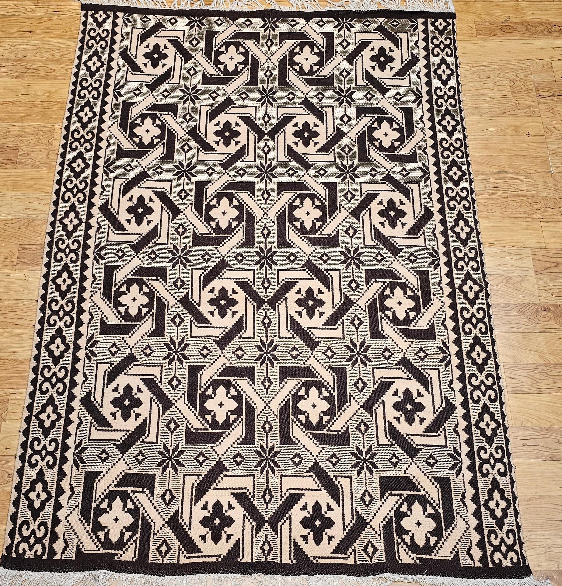 Discover the rustic beauty and cultural heritage of the American Southwest with this vintage handwoven kilim area rug, crafted circa the mid-20th century. Featuring a classic Southwestern geometric pattern, this flat-woven rug showcases an all-over