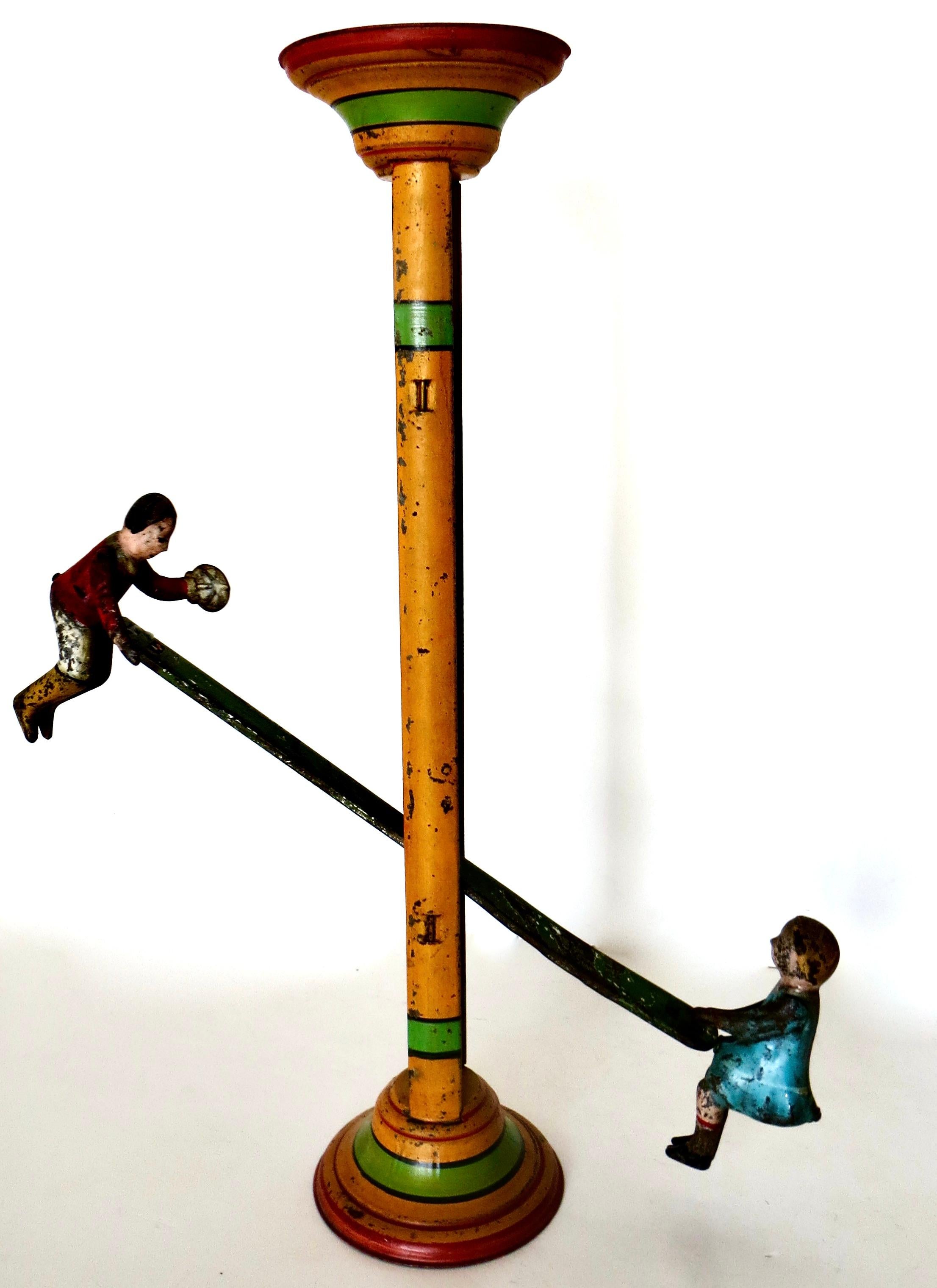 American hand painted tin toy with a 