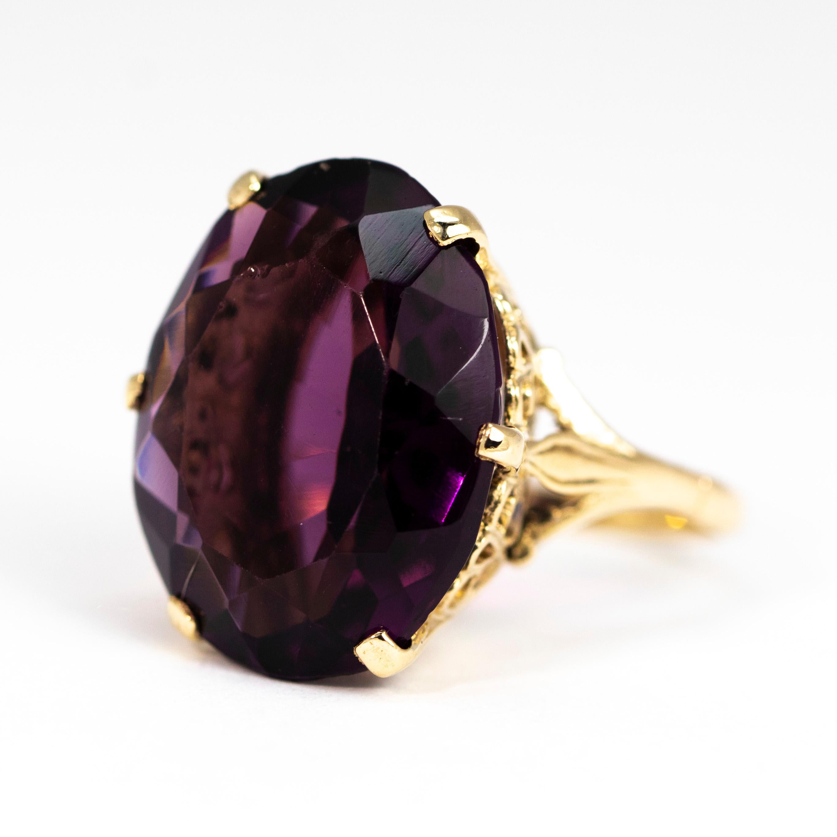 The stunning sone in this ring is a bright purple colour and reflects the light in a wonderful way as you can see in the pictures. The stone is held with a simple claw setting and a very ornate setting. 

Ring Size: L 1/2 or 6 
Stone Dimensions: 20