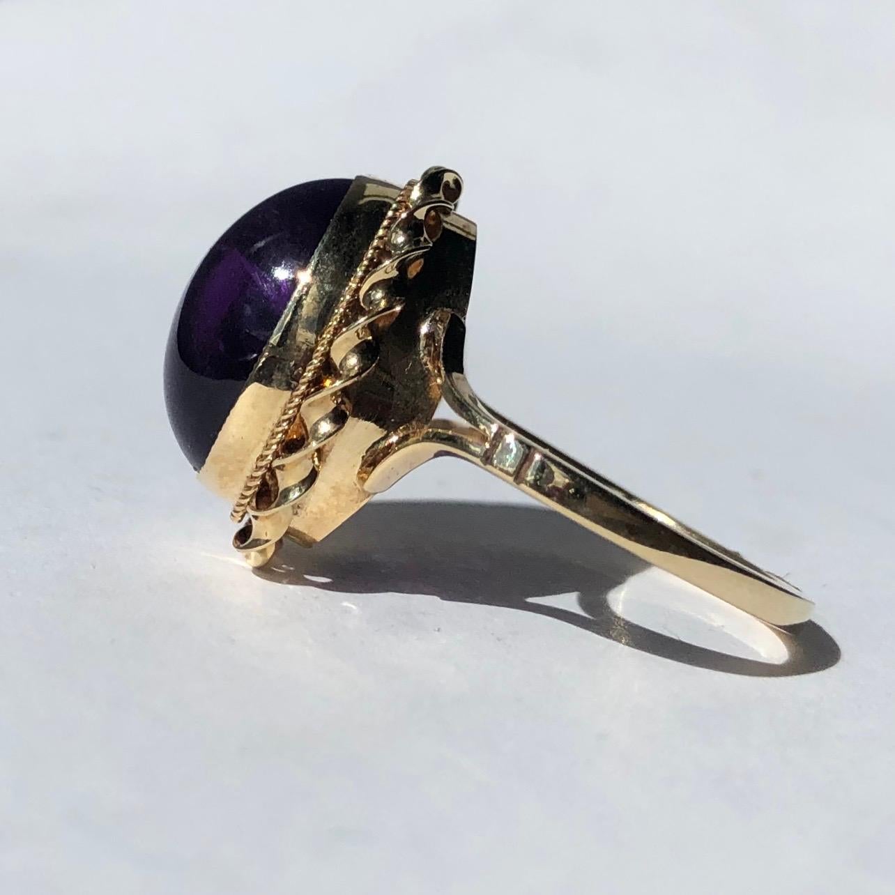 This glossy and bright purple amethyst stone is surrounded by a frame of thick and thin twists of gold. Modelled in 9ct gold and made in Birmingham, England. 

Ring Size: N or 6 3/4 
Stone Dimensions: 14x10mm 

Weight: 3.9g