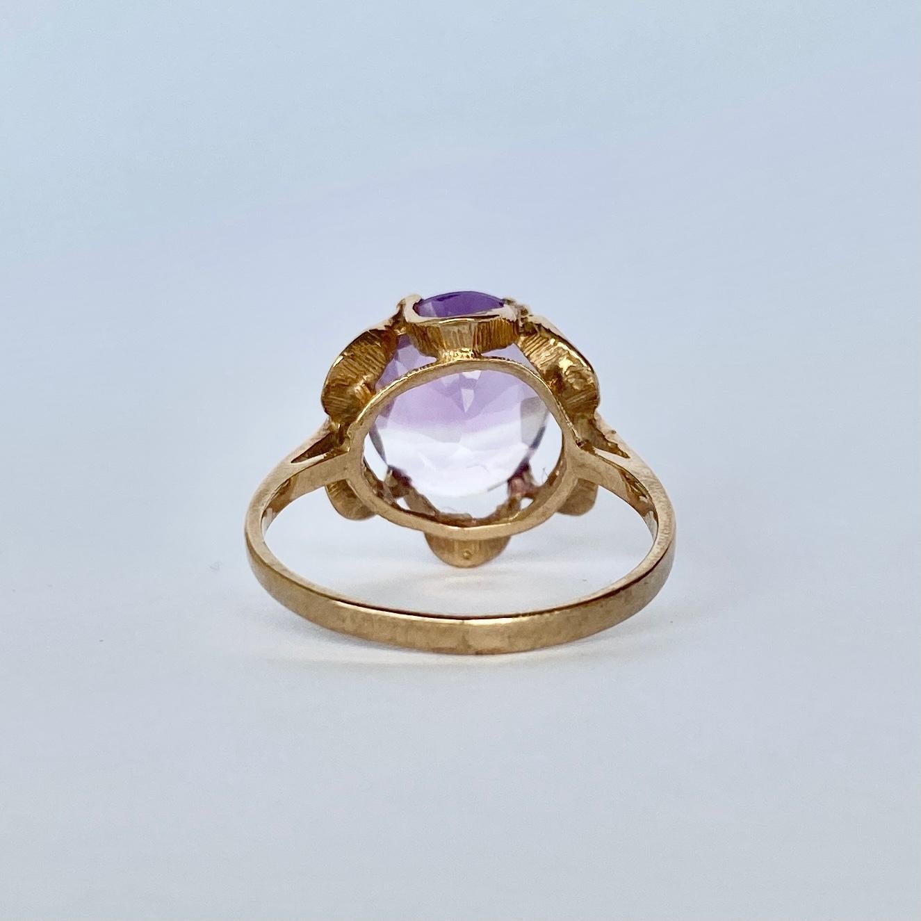 This stunning pale amethyst is set in a scalloped 9 carat gold setting. Fully hallmarked London 1989.

Ring Size: P or 7 3/4 
Stone Dimensions: 12x10mm

Weight: 2.9g