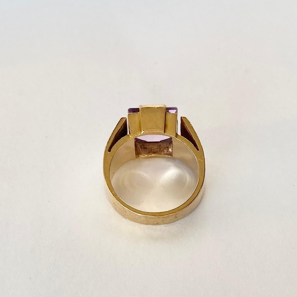 This glossy lilac amethyst stone is surrounded by a frame of gold which compliments perfectly. Modelled in 9carat gold. 

Ring Size: M or 6 1/4
Stone Dimensions: 10x10mm 

Weight: 7.7g