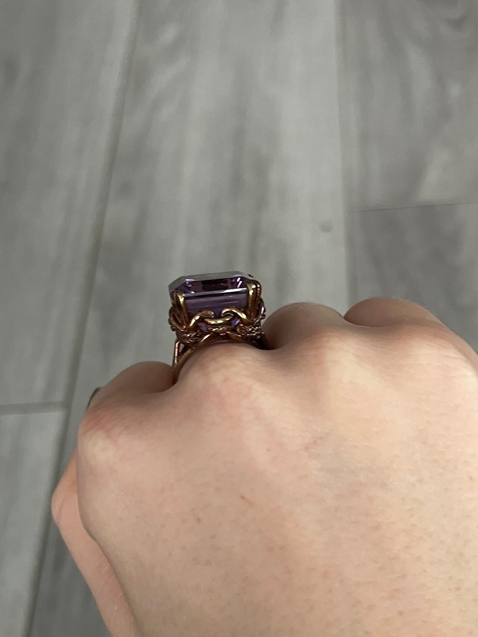 The amethyst set up high upon this ring is a gorgeous purple colour held in simple claws. Modelled in 9carat gold and has an ornate open work gallery. fully hallmarked London 1959.

Ring Size: N or 6 3/4
Stone Dimensions: 16x16mm 
Height Off Finger: