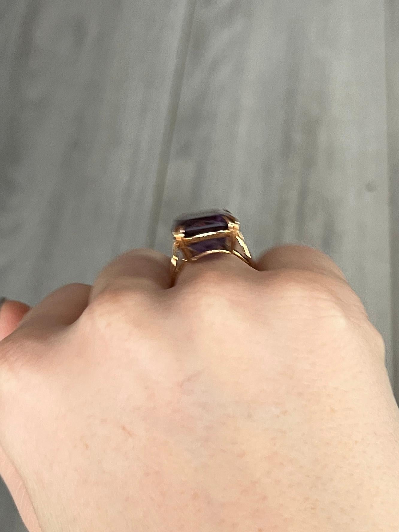 The amethyst set up high upon this ring is a gorgeous purple stone held in simple claws. Modelled in 9carat gold and has an open work gallery. Hallmarked Birmingham 1972.

Ring Size: H or 3 3/4
Stone Dimensions: 17x13mm 

Weight: 4.8g