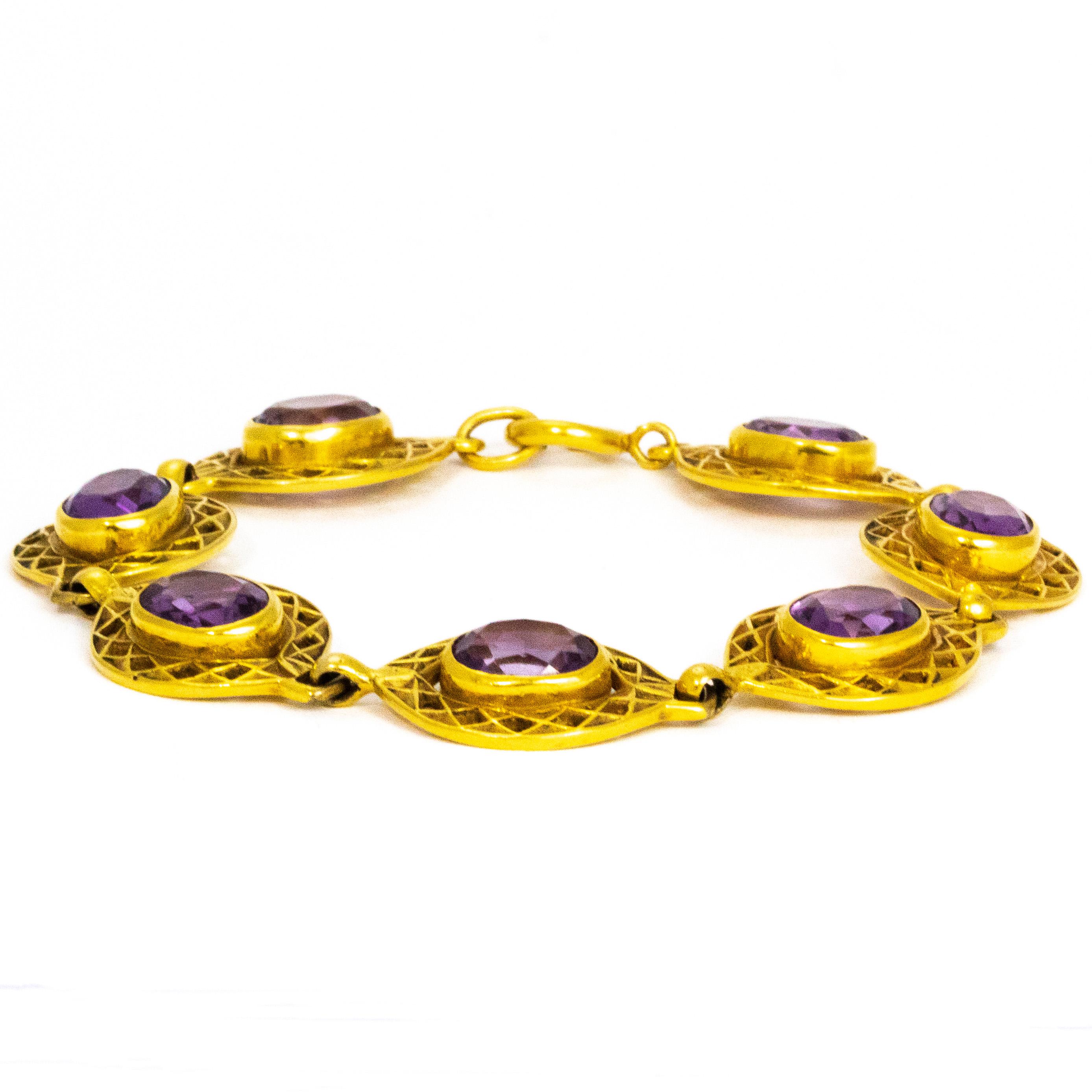 Each link in this bracelet is loaded with detail and holds seven gorgeous amethyst stones measuring 2carats each. The style of the bracelet has a very Art Deco feel and is wonderfully stylish. 

Bracelet Length: 7.5inches
Width: 16mm 