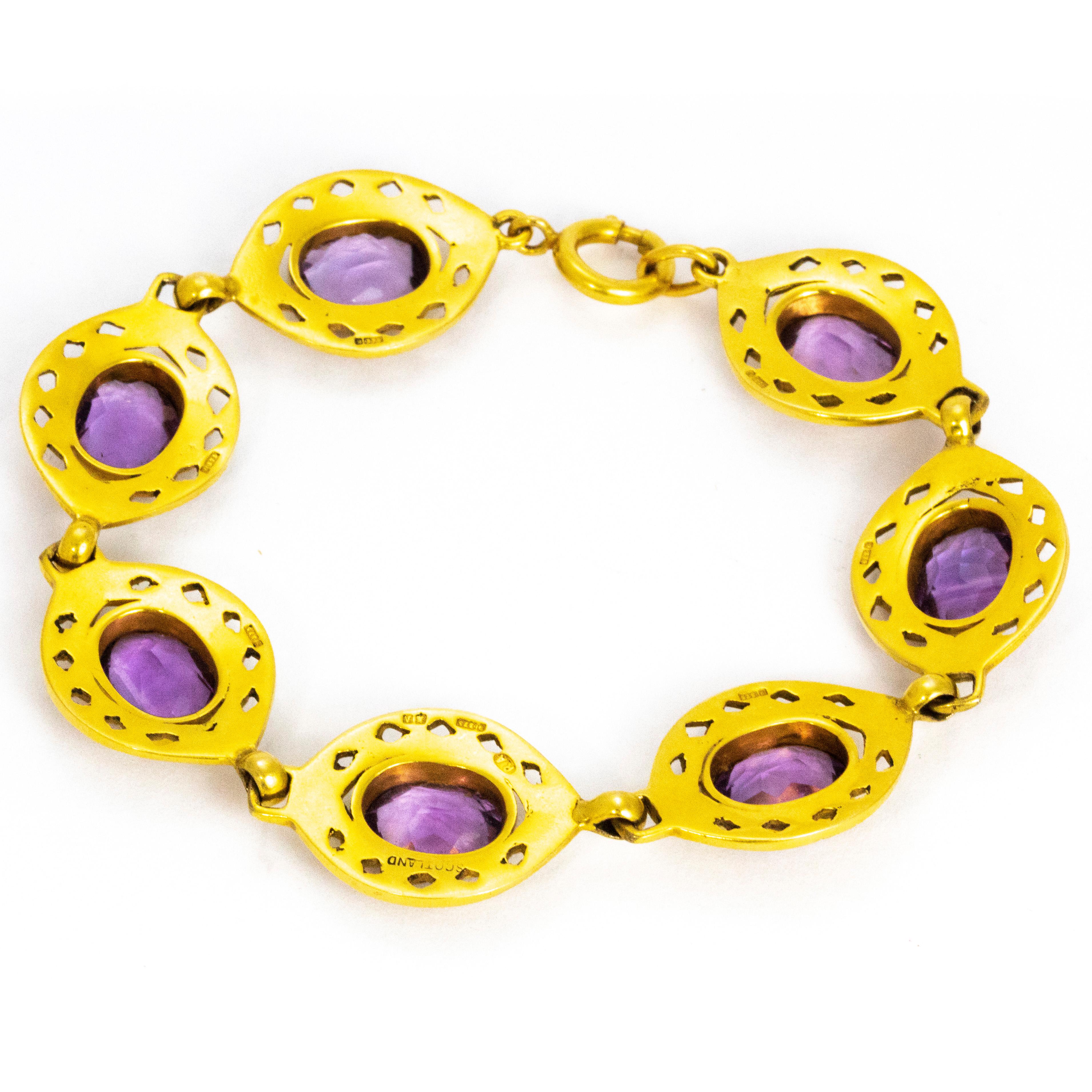 gold bracelet with purple stones