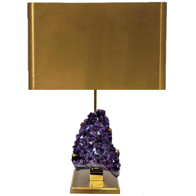 Information:
This vintage amethyst table lamp is attributed to Willy Daro. Willy Daro is famous for creating and designed spectacular table lamps made from precious and unusual material. 

The base is made from polished brass on which a large geode