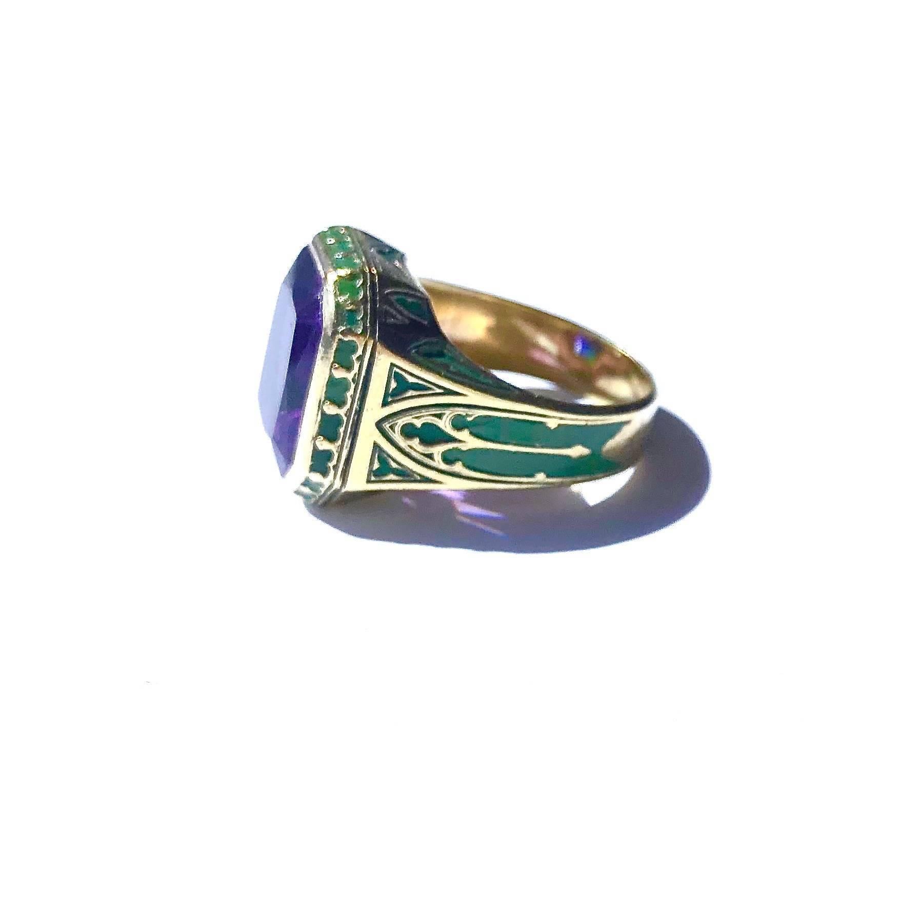 Crafted in 14K yellow gold, the ring features an approximately 10ct rectangular shape amethyst set within a gold bezel, supported by an eleven millimeter wide shoulders tapering down to a five millimeter wide band. The ring is decorated with