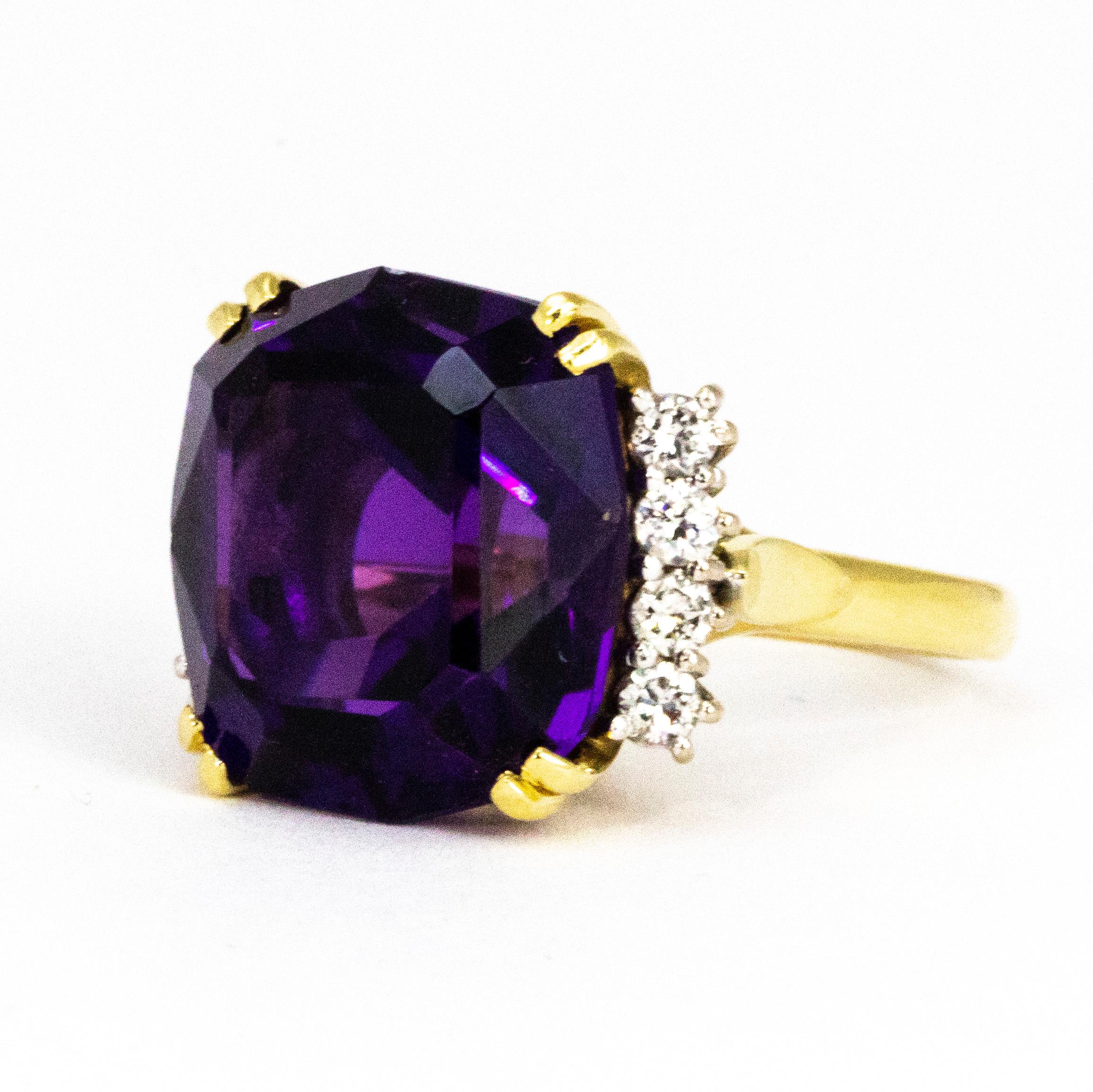 The main attraction of this ring has to be the beautiful deep purple amethyst sat at the centre. The stone measures approximately 20carats and reflects the light beautifully.Either side of the stone there is a fan of round cut diamonds each