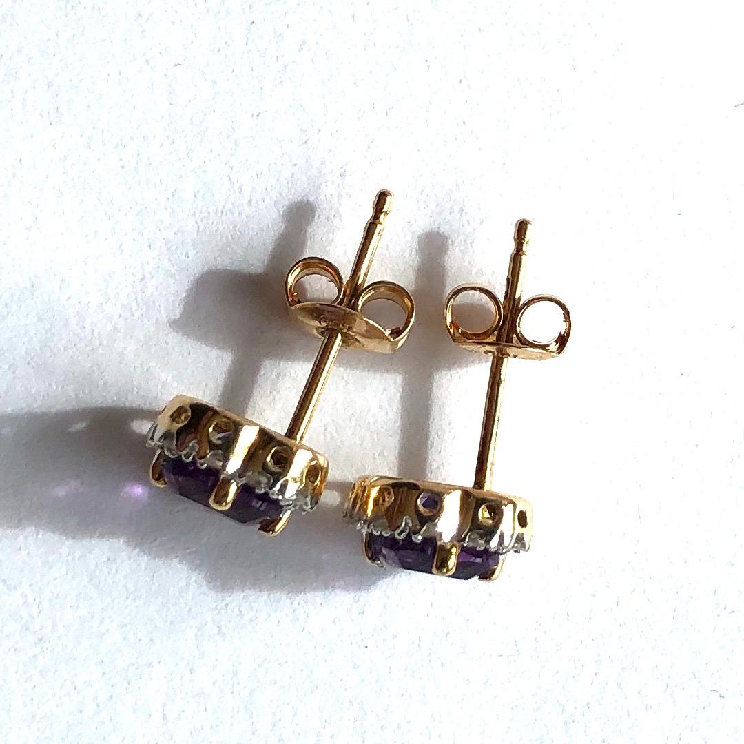 The stunning stones in these stud earrings are set in platinum and the rest of the earring is modelled in 18ct gold. The amethysts are a gorgeous deep lilac colour and are exquisitely complimented by the halo of diamonds surrounding them. The
