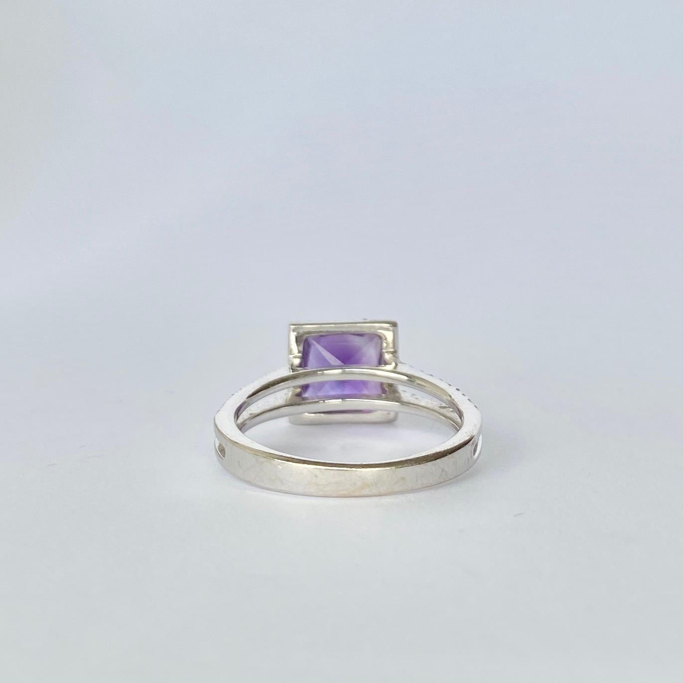 The gorgeous amethyst stone in this cluster is a bright purple colour which is complimented by the bright diamonds which surround it. The diamonds total 80pts and the amethysts total approx 1.5ct. The ring is modelled in 18ct white gold.  

Ring