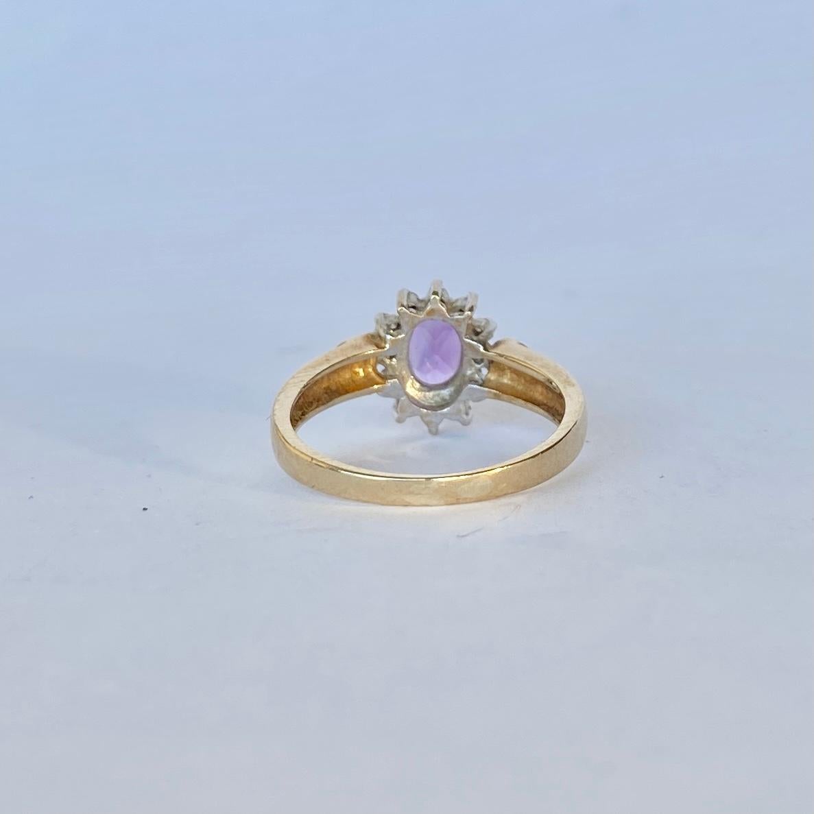 The style of this ring is stunning and classic. At the centre of this piece sits a 70pt amethyst which has wonderful sparkle and around this stone there is a halo of diamond points swell as a diamond point in each shoulder. The stones are set in
