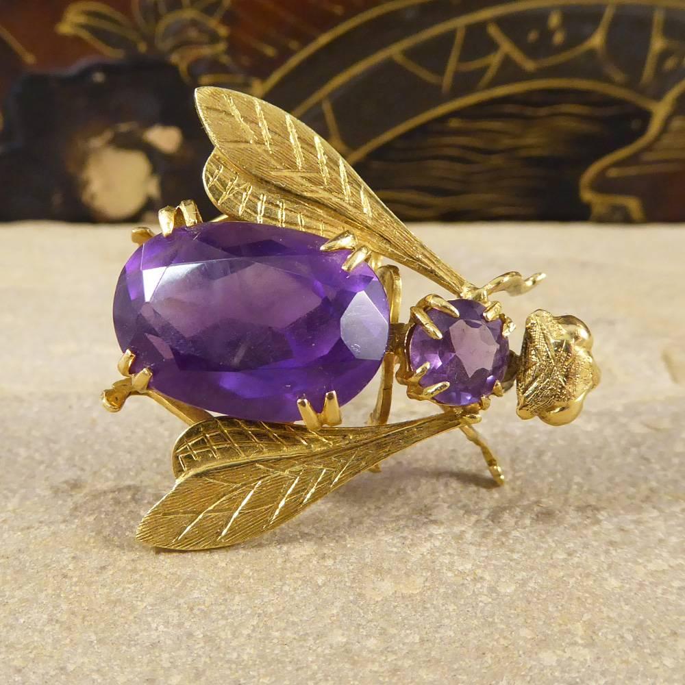 This piece features two Amethyst gemstones forming the body of the fly with detailed yellow Gold wings in a yellow Gold setting. A beautiful Vintage Brooch to adorn your clothing.

Condition: Very Good, slightest signs of wear due to age and