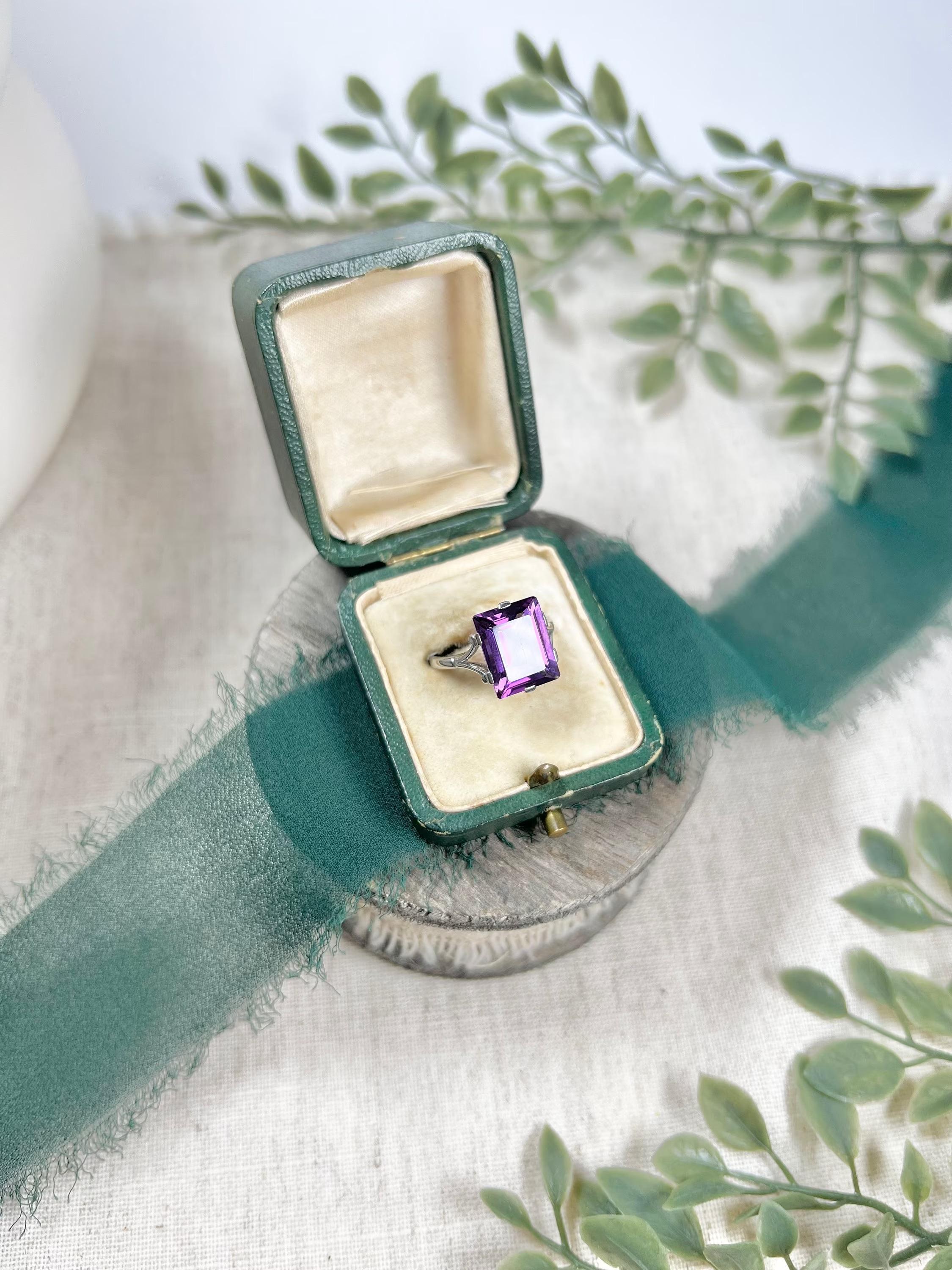 Vintage Cocktail Ring

Platinum Stamped 

Circa 1940’s

Fabulous, vintage cocktail ring. Set with a lovely sized, emerald cut, natural amethyst. Mounted on a platinum stamped band with pretty, split shoulders. 

Face of the ring measures approx