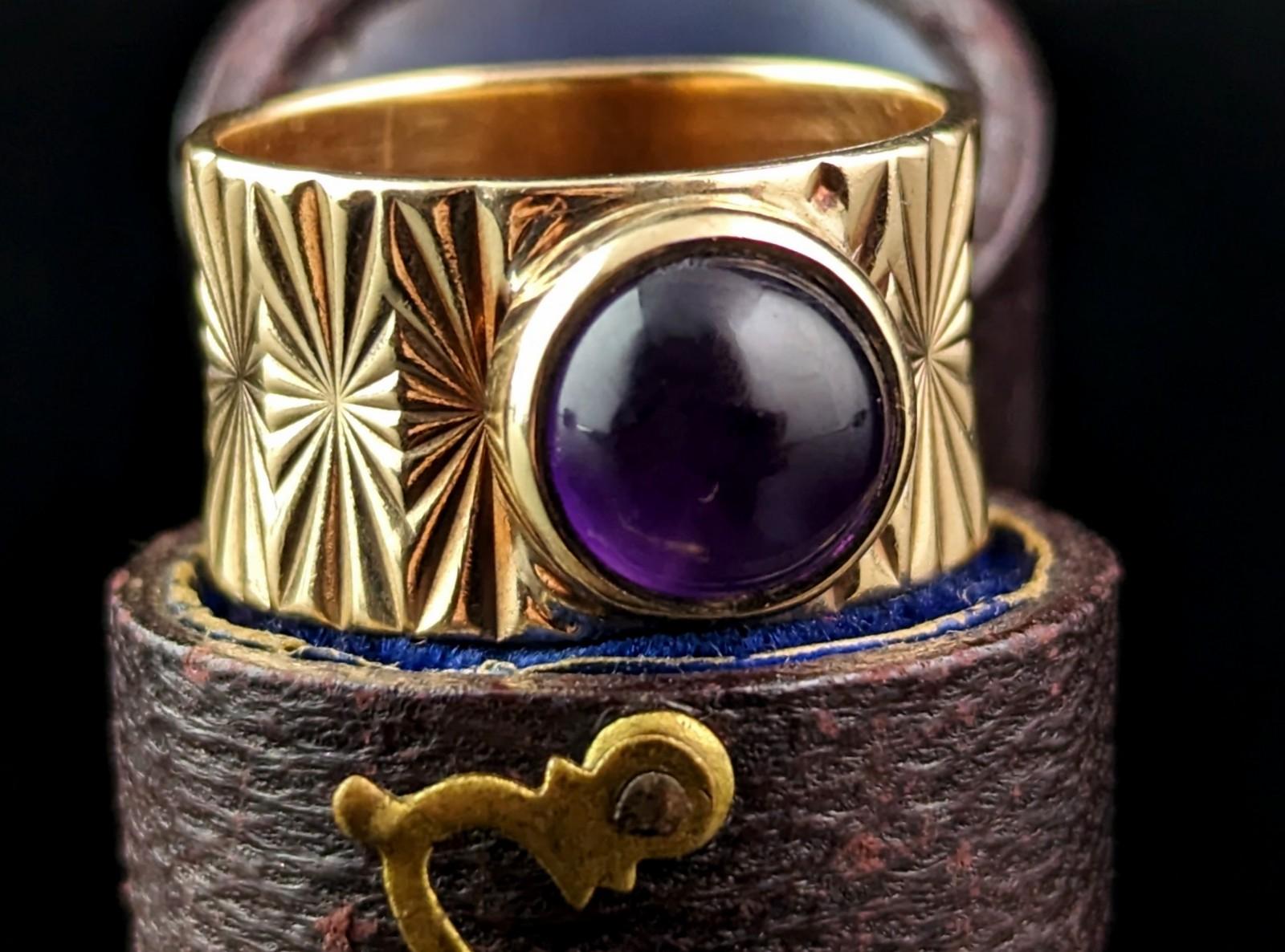 Wow is the only word to describe this amazing vintage Amethyst cocktail band ring.

A real testament to the bold, Avant Garde styles that emerged in the 60s and into the 70s.

It has a rich, regal feel to it and it says luxury through and through,