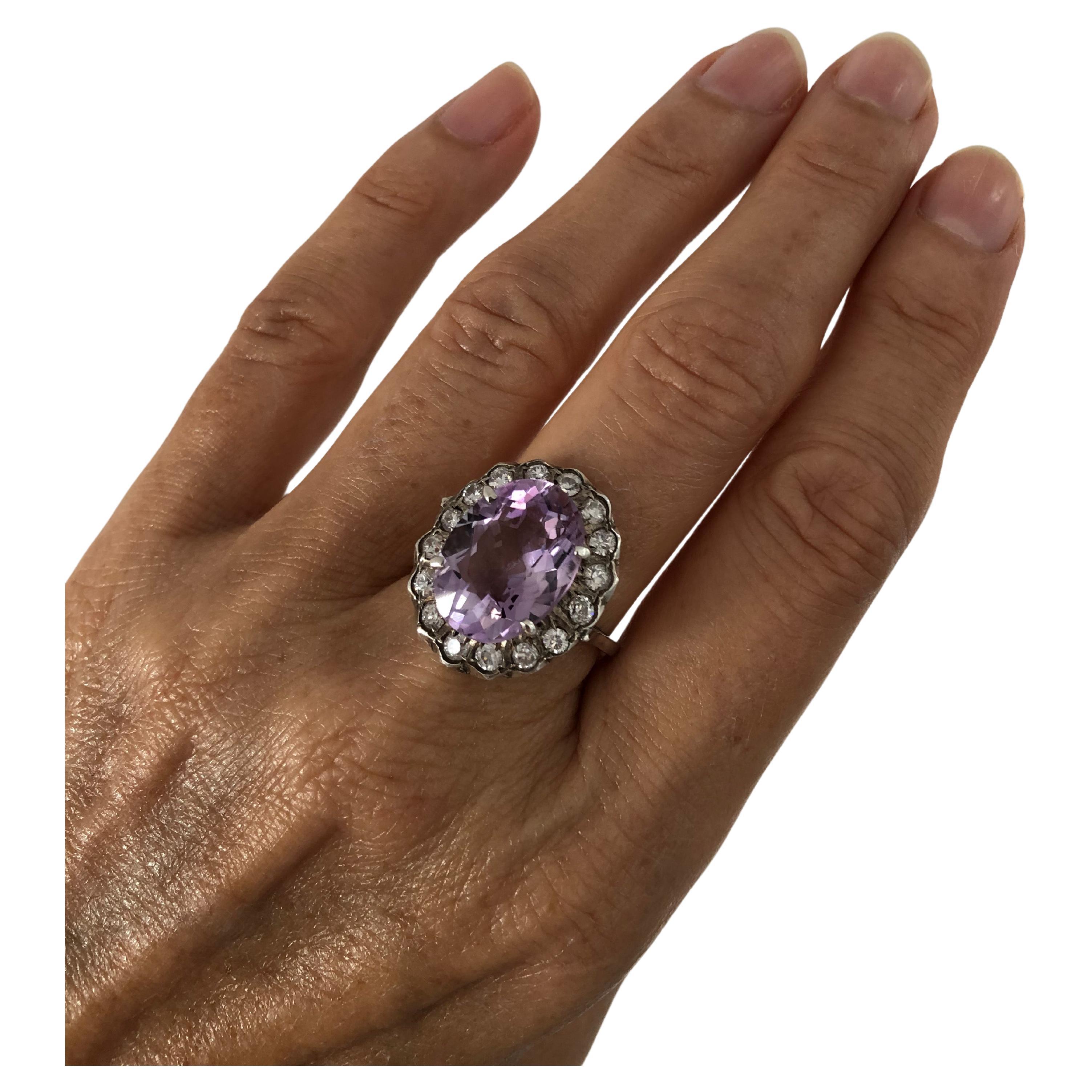 Vintage European ring, beautiful large amethyst surrounded with a glittering cubic zirconia mounted in sterling silver marked 925. Stunning statement cocktail ring. Measuring about 0.82inch by 0.76 inch, weight about 7.50 grams.