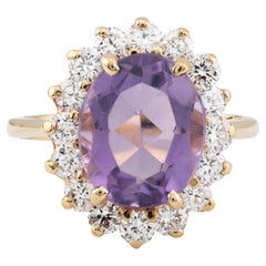 Anello vintage con ametista e diamante a raggiera in oro giallo 14 carati