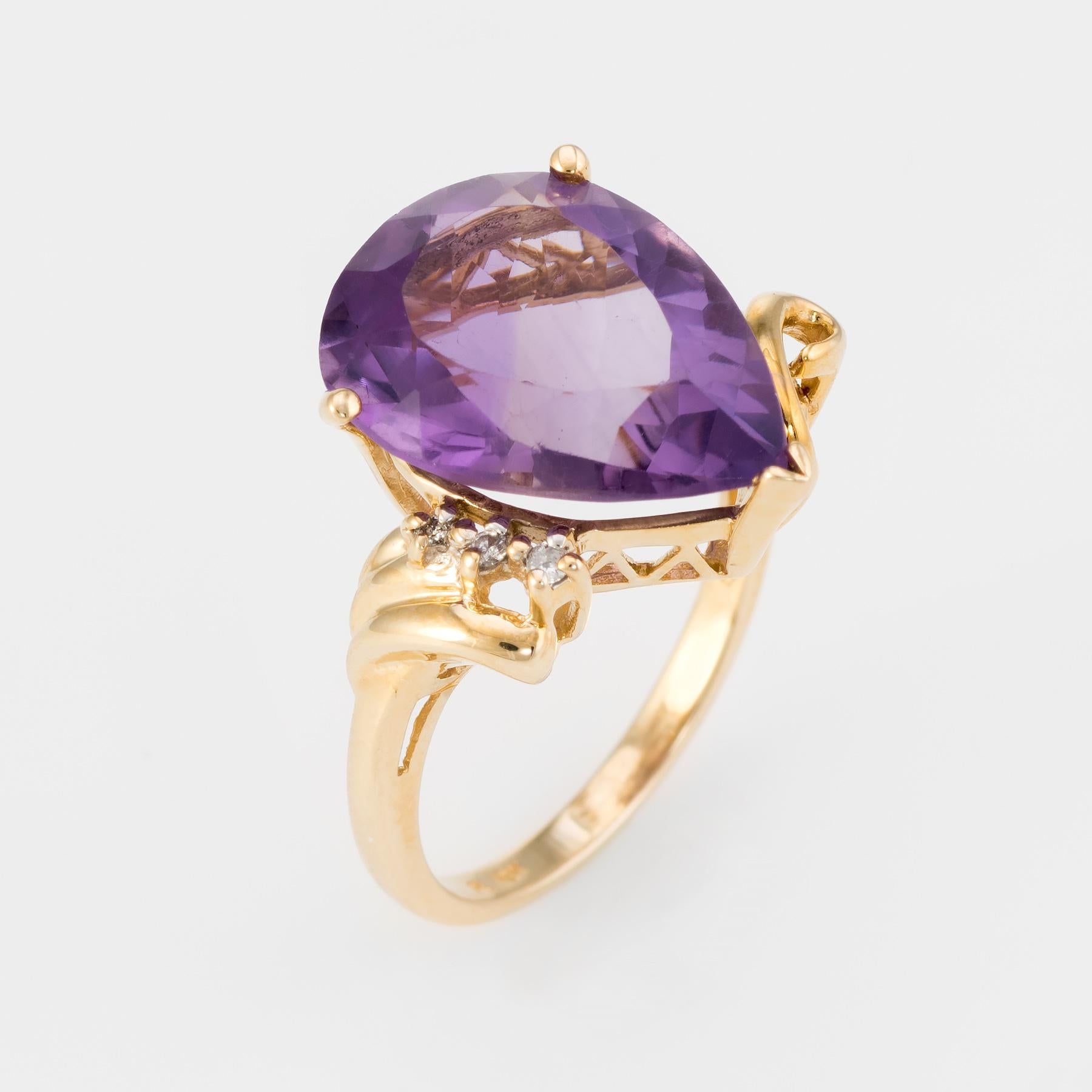 Finely detailed vintage amethyst & diamond cocktail ring, crafted in 10 karat yellow gold. 

Centrally mounted pearl cut amethyst measures 15.5mm x 12mm (estimated at 7.50 carats), accented with three diamonds (estimated at 0.02 carats - I-J color