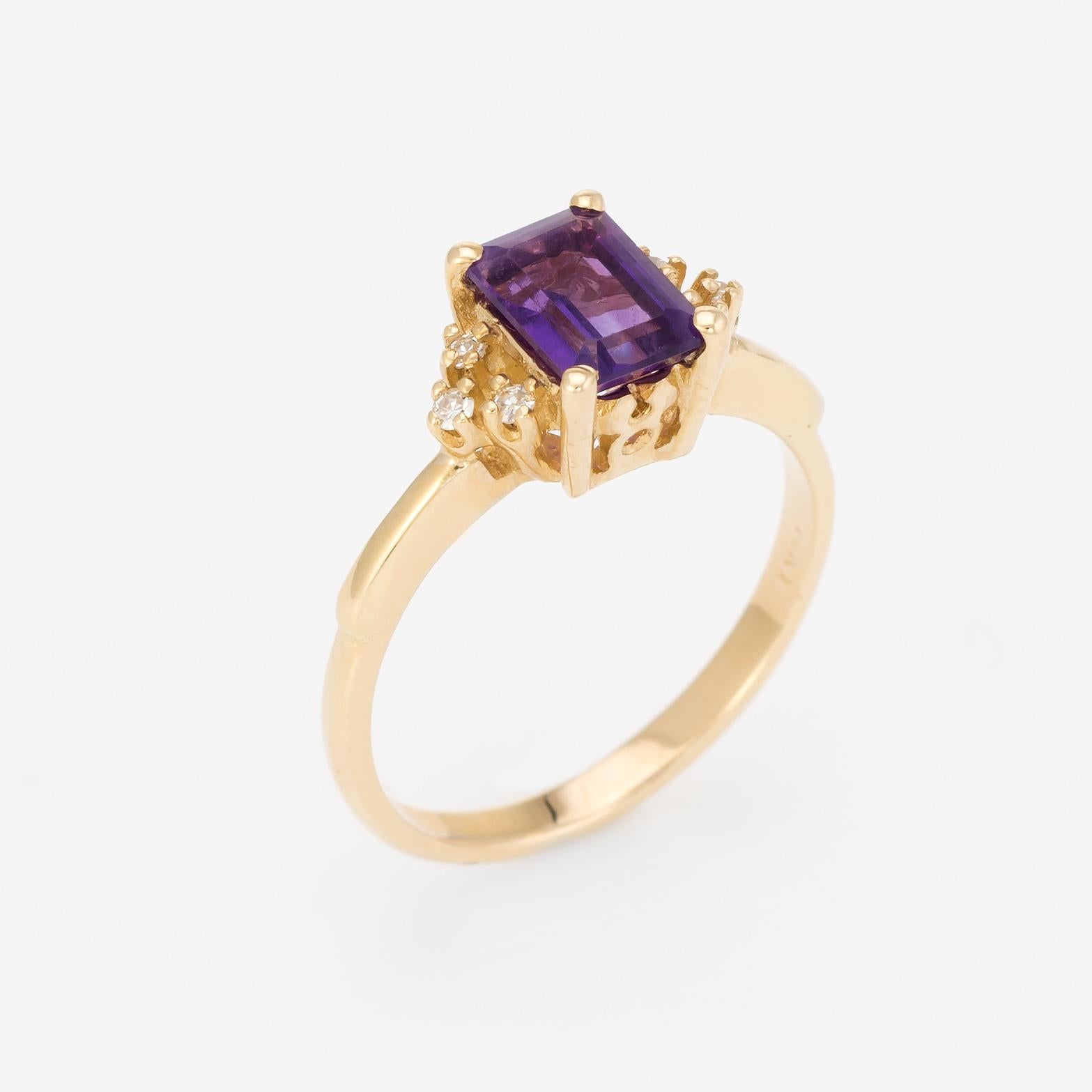 Finely detailed vintage amethyst & diamond cocktail ring, crafted in 14 karat yellow gold. 

Centrally mounted emerald cut amethyst measures 7mm x 5mm (estimated at 1 carat), accented with six estimated 0.01 carat single cut diamonds (0.06 carats