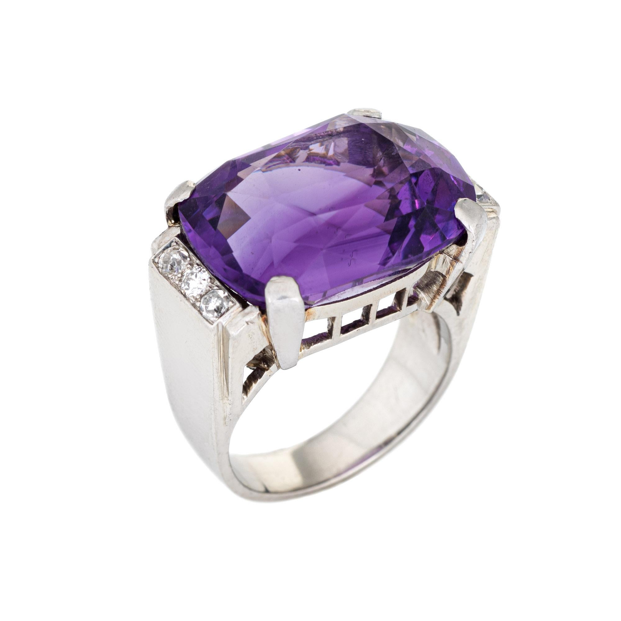 Stylish vintage amethyst & diamond cocktail ring crafted in 14 karat white gold. 

Oval faceted amethyst measures 18mm x 13.5mm. Six diamonds total an estimated 0.12 carats (estimated at H-I color and SI1-I1 clarity). The amethyst is in very good
