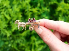 Broche vintage amatista granate peridoto oro amarillo burro y carro circa 1970