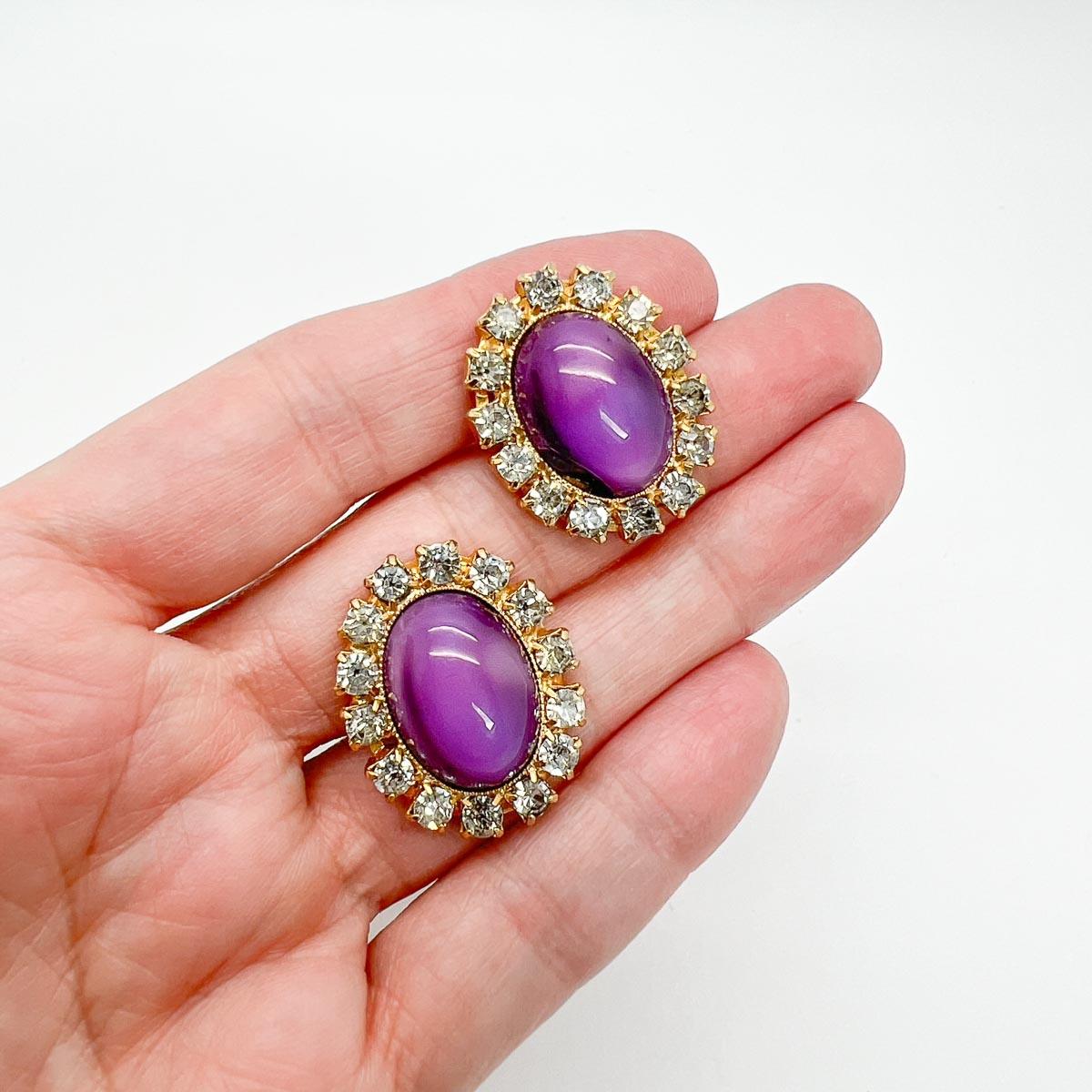 Vintage Amethyst Cabochon Earrings, Royally rich cabochon amethyst glass stones will add a touch of opulence to your look.
An unsigned beauty. A rare treasure. Just because a jewel doesn’t have a designer name, doesn’t mean that isn’t coveted. The