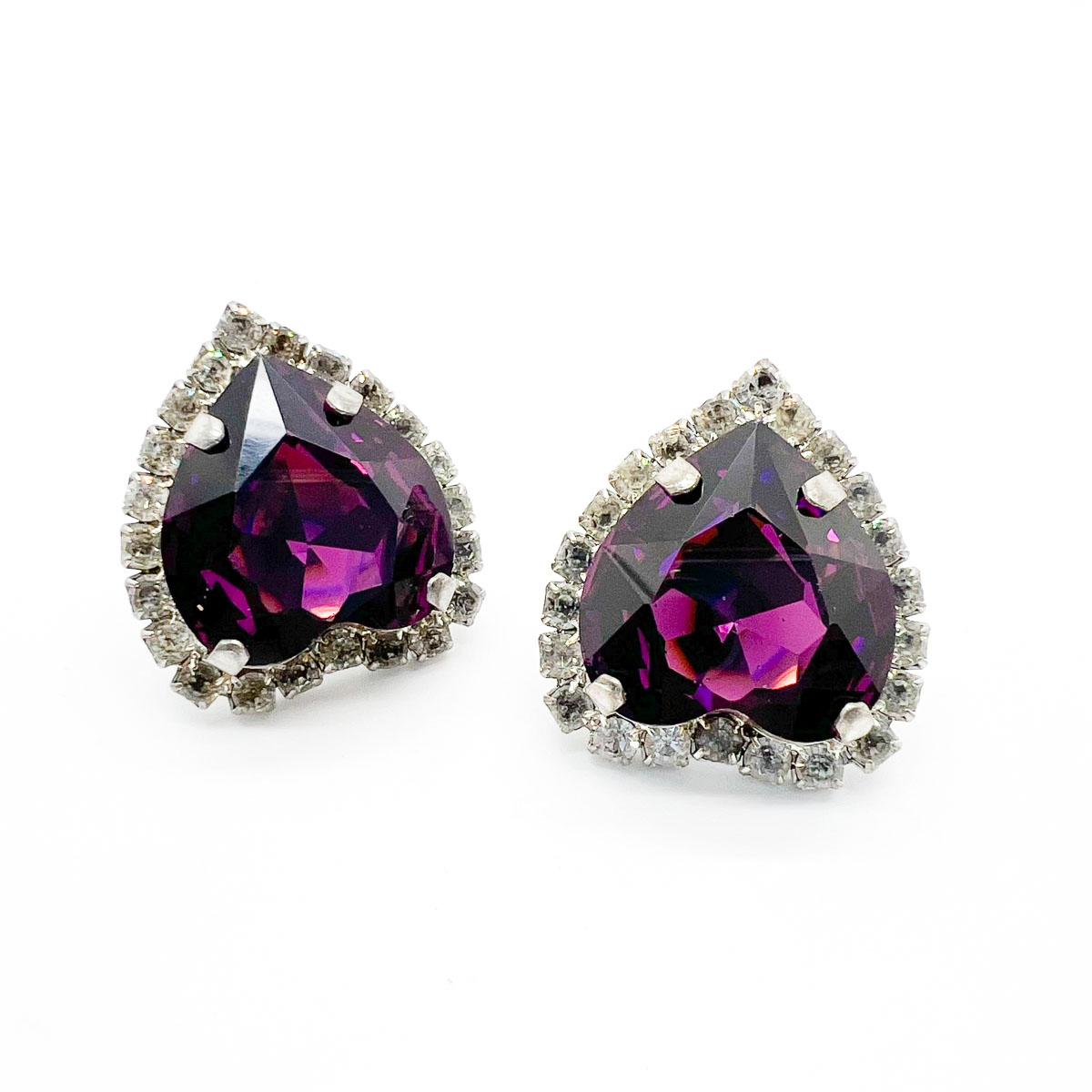 Vintage Amethyst Heart Earrings. Wonderfully glamorous these oversize amethyst crystal heart stones are captivating. Finished with a gallery of white chatons, these sparkling statement clips are a stunning find.
An unsigned beauty. A rare treasure.