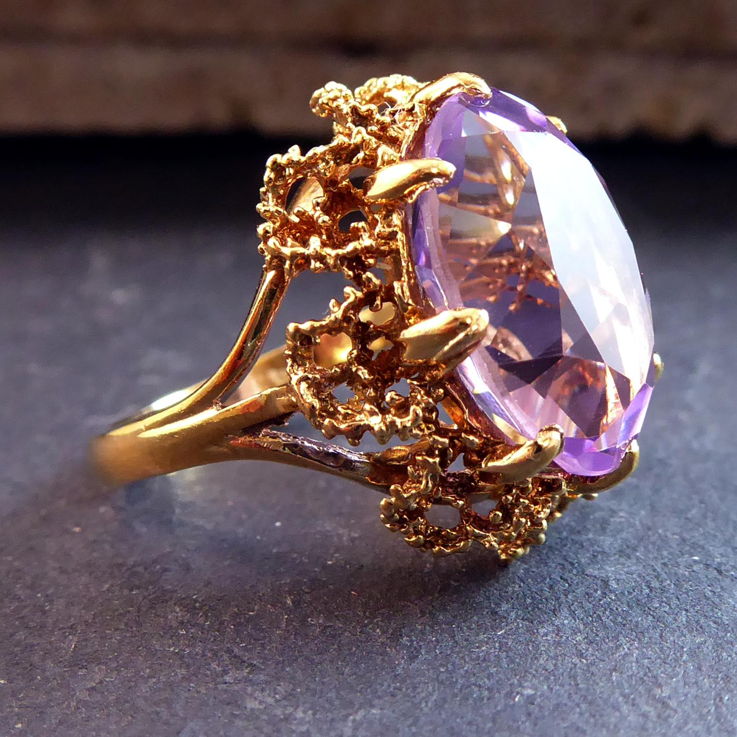 Vintage amethyst cocktail ring set with an oval faceted amethyst measuring approx. 0.63