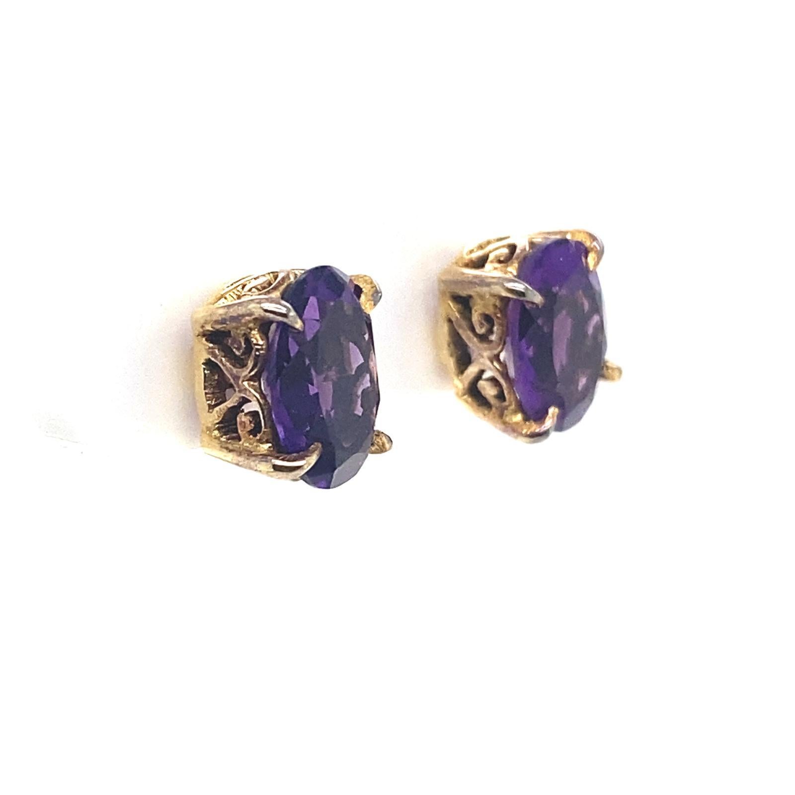 A pair of vintage amethyst oval stud earrings in 15 karat yellow gold.

This pair of oval cut amethyst stud earrings total 1.16 carats approximately and are claw set in 15 karat yellow gold fittings.

The deep purple hue of the amethysts are a