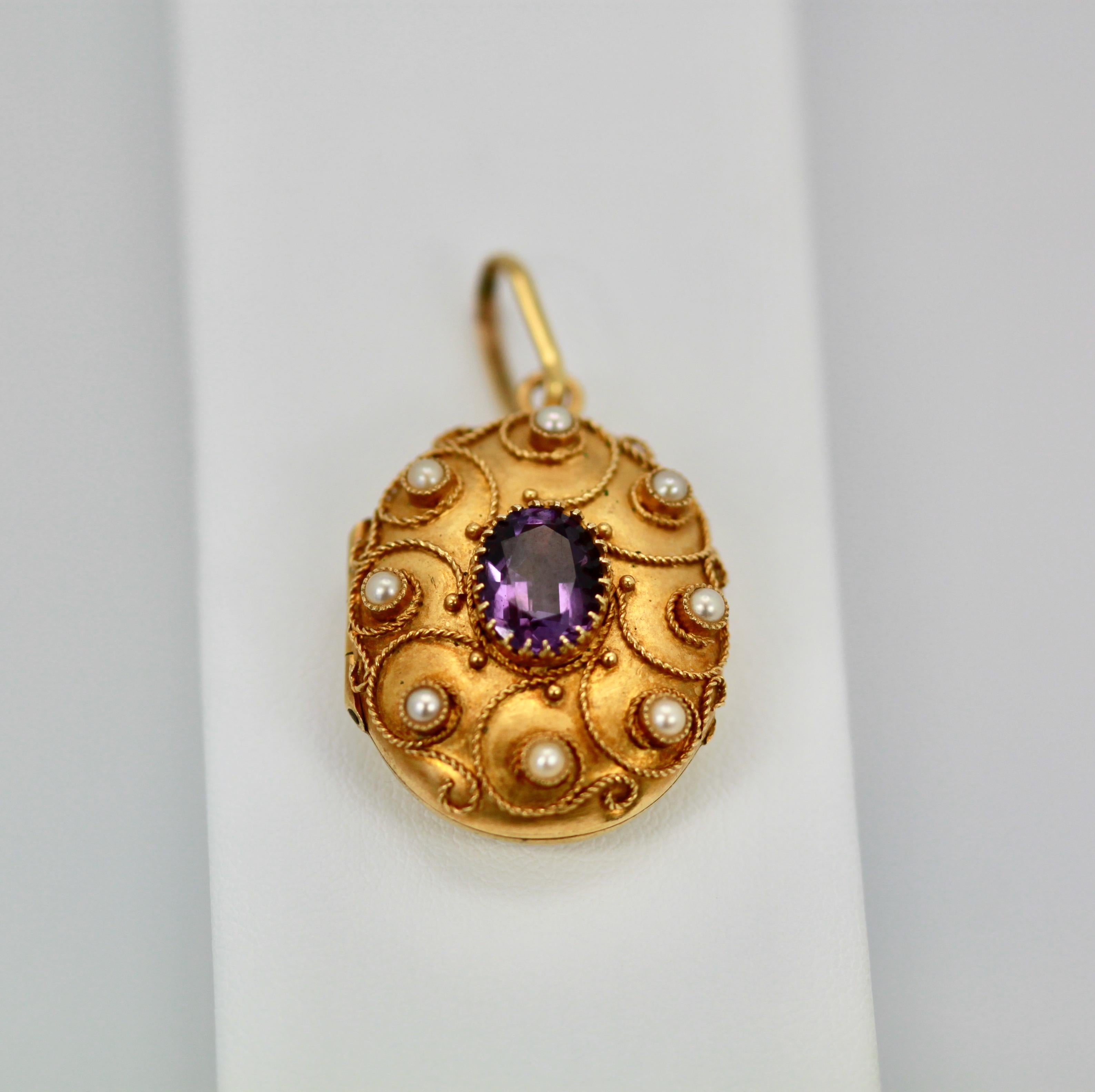 This lovely Amethyst Pearl Locket is from Austria and is done in 18K yellow Gold.
The front have beautiful filigree work with seed pearls surrounding the piece.  In the center is a beautiful Amethyst of approximately 1.50 carats.  There are 8 seed