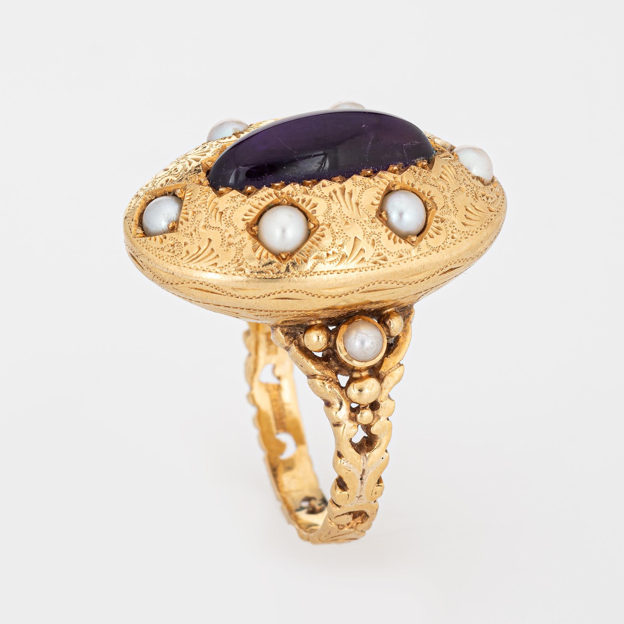 Stylish vintage amethyst & pearl cocktail ring crafted in 14 karat yellow gold. 

Cabochon cut amethyst measures 17mm x 6mm (estimated at 3.50 carats), accented with 8 x 3mm pearls. The amethyst is in very good condition and free or cracks or chips.